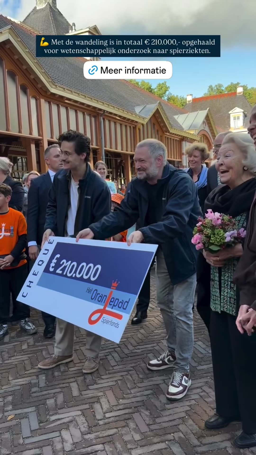 A reshared story of the cheque presentation for the Oranjepad charity walk for the Prinses Beatrix Spierfonds: a banner is turned over to reveal a €210,000 cheque, with a text overlay saying the walk raised €210,000 for scientific research on muscle diseases.