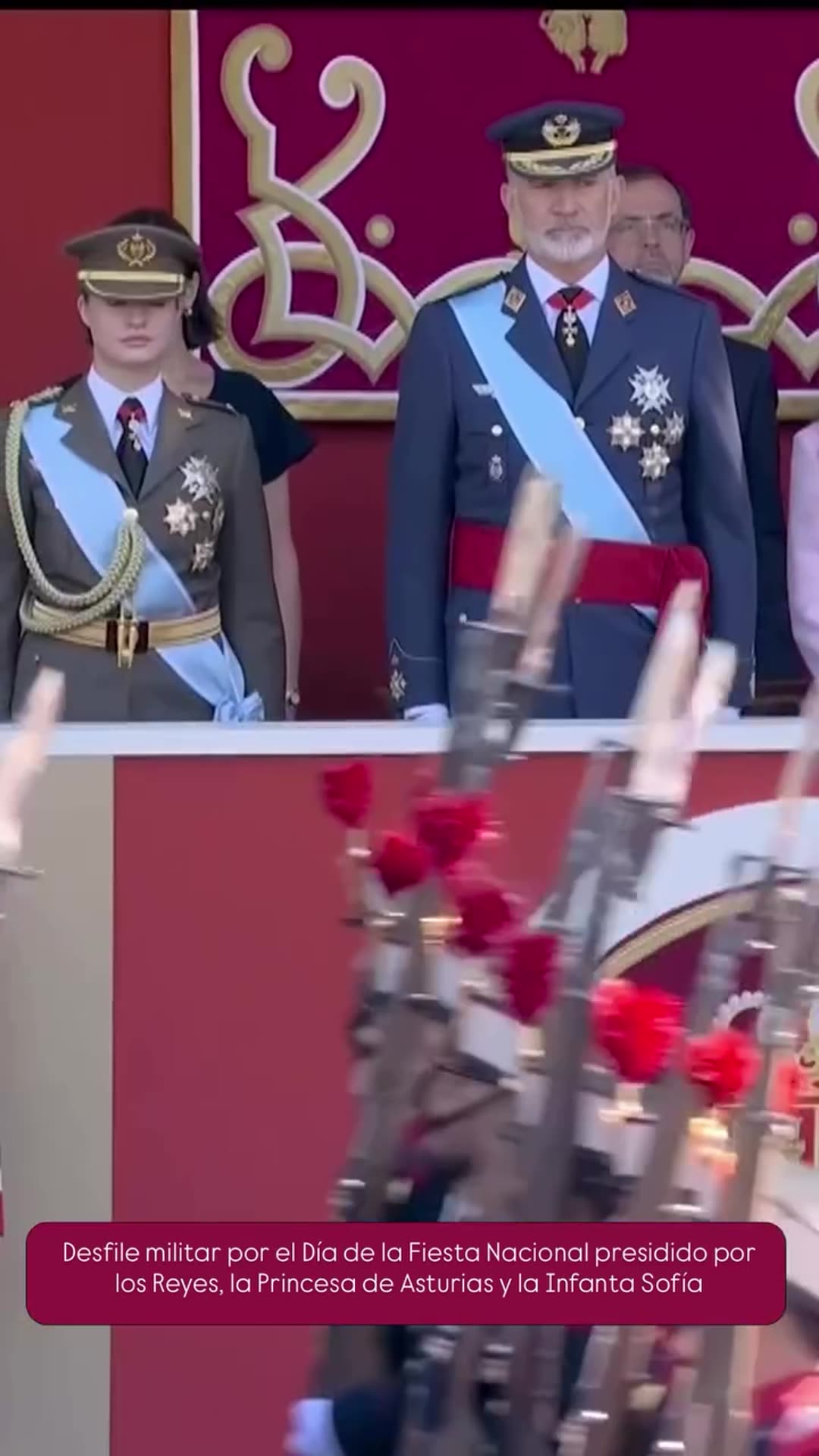 A story reshares a Casa Real video of the military parade for the Spanish National Day, with helicopter and jet flypasts, vehicles, marching units, flag bearers and horse-drawn units passing the royal stand.