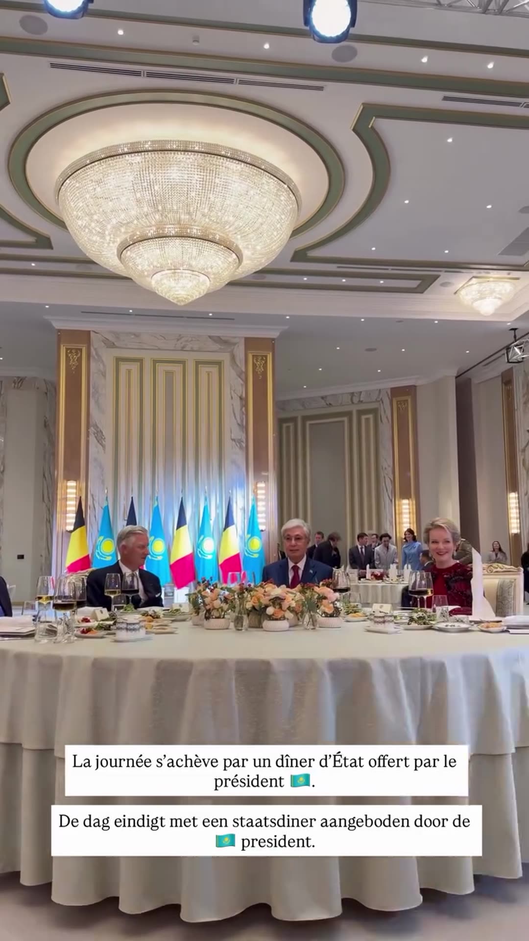 A story reshares a Belgian Royal Palace video of a state dinner hosted by the president in a grand hall with Belgian and Kazakh flags, closing the day of the state visit.