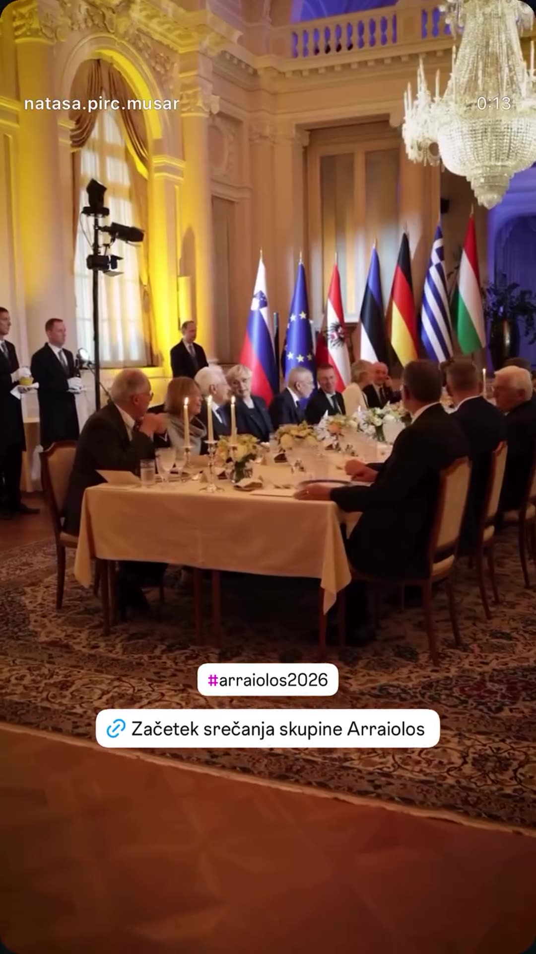A story reshares a video from the Slovenian president's account showing the start of the Arraiolos group meeting: guests arriving and being welcomed on carpets at night, the formal dinner with flags, a speech and a folk music performance.