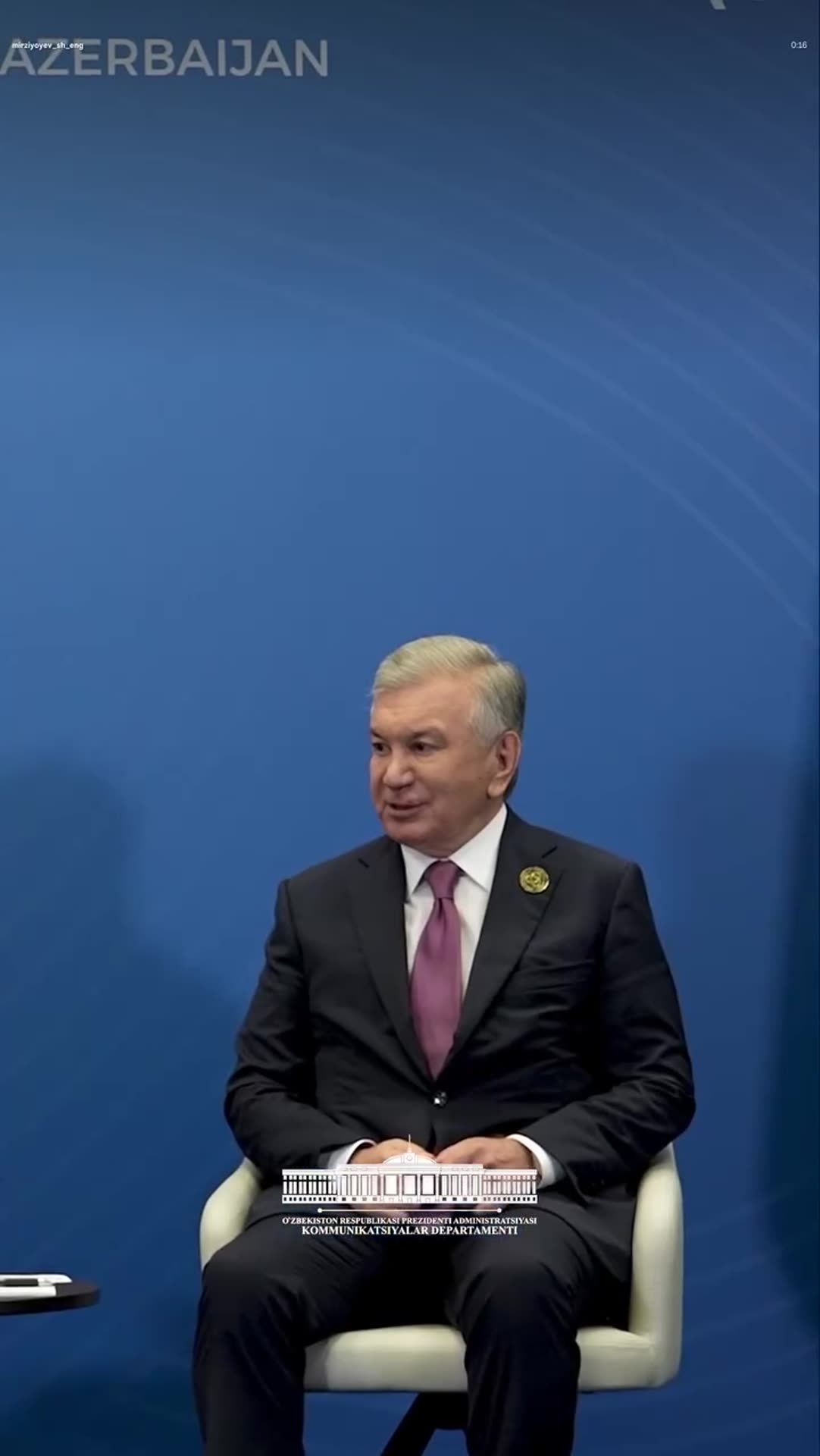 A story reshares the Uzbek president's reel of his meeting with the Prime Minister of Cambodia on the sidelines of a summit in Baku, showing a handshake, the two seated leaders, and an aerial view of a Baku building.