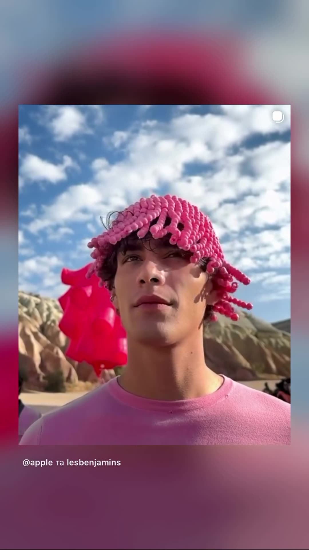 A story reshares Apple's carousel about the Les Benjamins 15-year anniversary collection 'From Earth to Sky', shot on iPhone 18 Pro in Cappadocia. It shows models in pink outfits, giant inflatable hot air balloons, a runway show and backstage makeup.