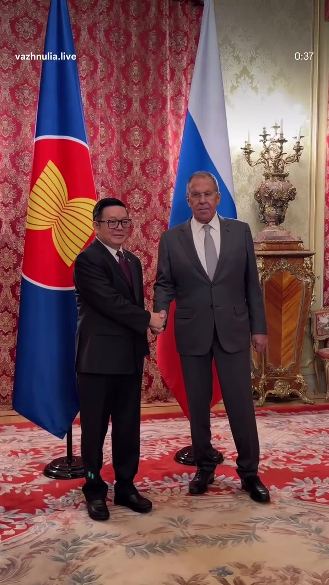 A story reshares a reel by @vazhnulia.live with behind-the-scenes protocol footage of Sergey Lavrov's meeting with the ASEAN Secretary-General: the entrance, handshake in front of the flags, and the delegations settling at the table.