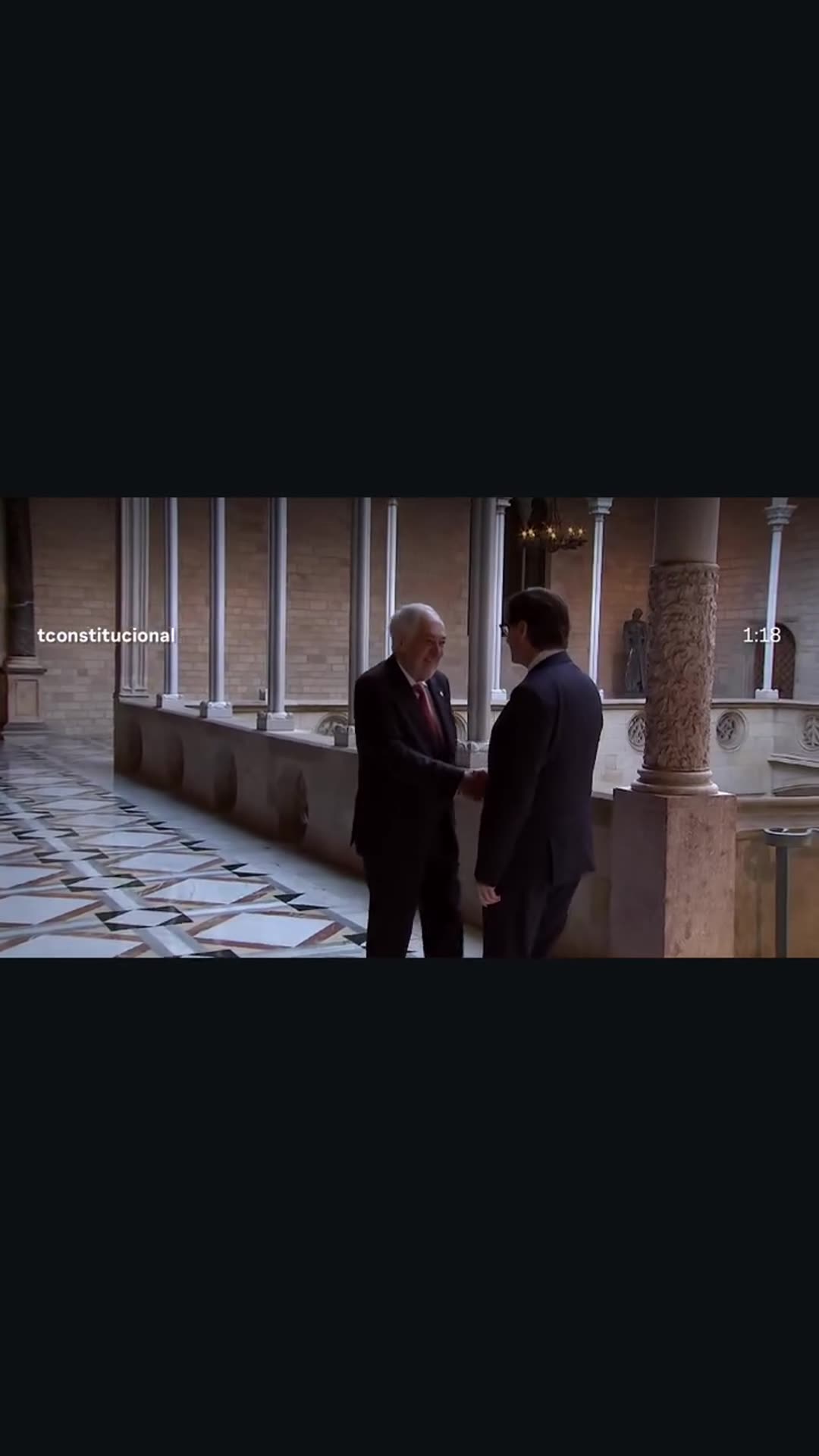 A story reshares a Tribunal Constitucional España reel of the institutional visit of the court's president to the Catalan regional president. The footage shows a handshake in a gallery, signing the guest book, a photo call outside, and a seated meeting under Catalan, Spanish and EU flags.