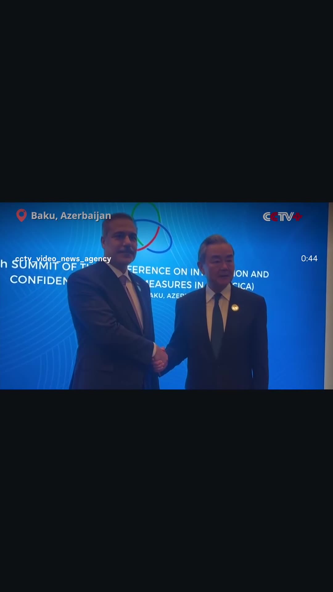 A story reshares a CCTV Video News Agency reel of Chinese Foreign Minister Wang Yi meeting Turkish Foreign Minister Hakan Fidan on the sidelines of the CICA summit in Baku, showing the handshake and the delegation talks.