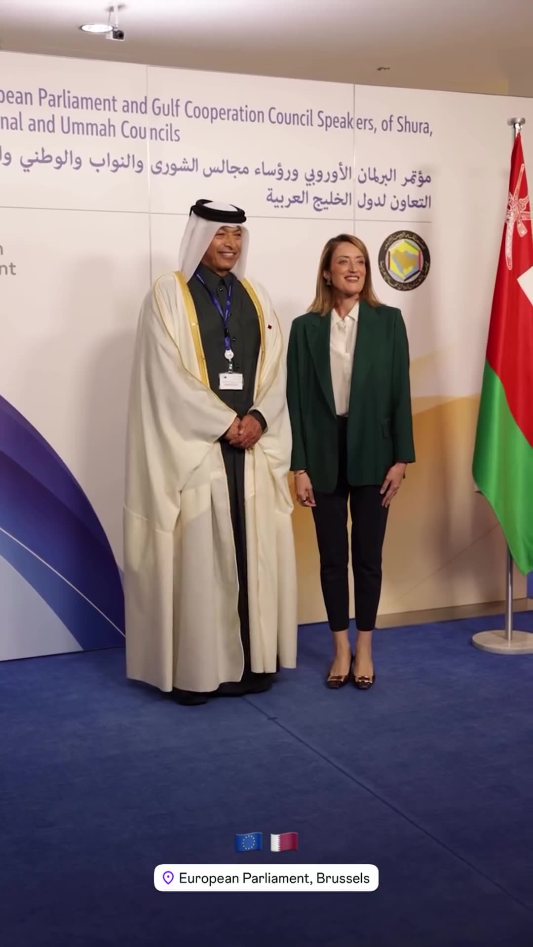 A reshared story from Roberta Metsola shows a Gulf delegate in traditional dress arriving at the European Parliament, being greeted with a handshake and posing for a photo in front of a backdrop for the EU–GCC speakers' conference.