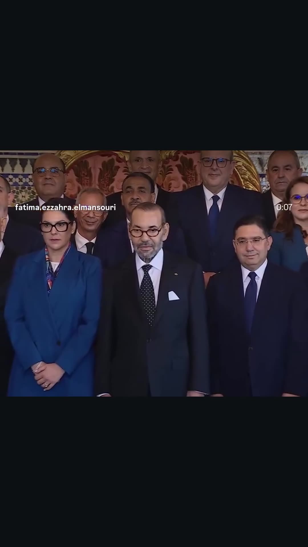 A story reshares a reel by Fatima Ezzahra El Mansouri of the ceremony at the Royal Palace in Rabat where King Mohammed VI appoints the members of Morocco's new government, ending with a commemorative group photo.
