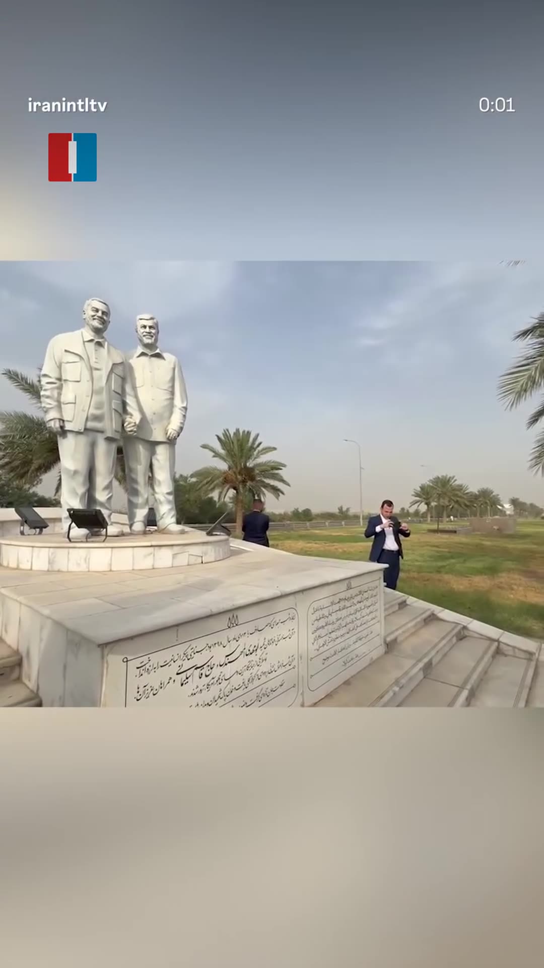 A story reshares an Iran International reel showing Iranian foreign minister Abbas Araghchi, on arrival in Iraq, visiting the statue of Qassem Soleimani and Abu Mahdi al-Muhandis, as the Persian caption states.