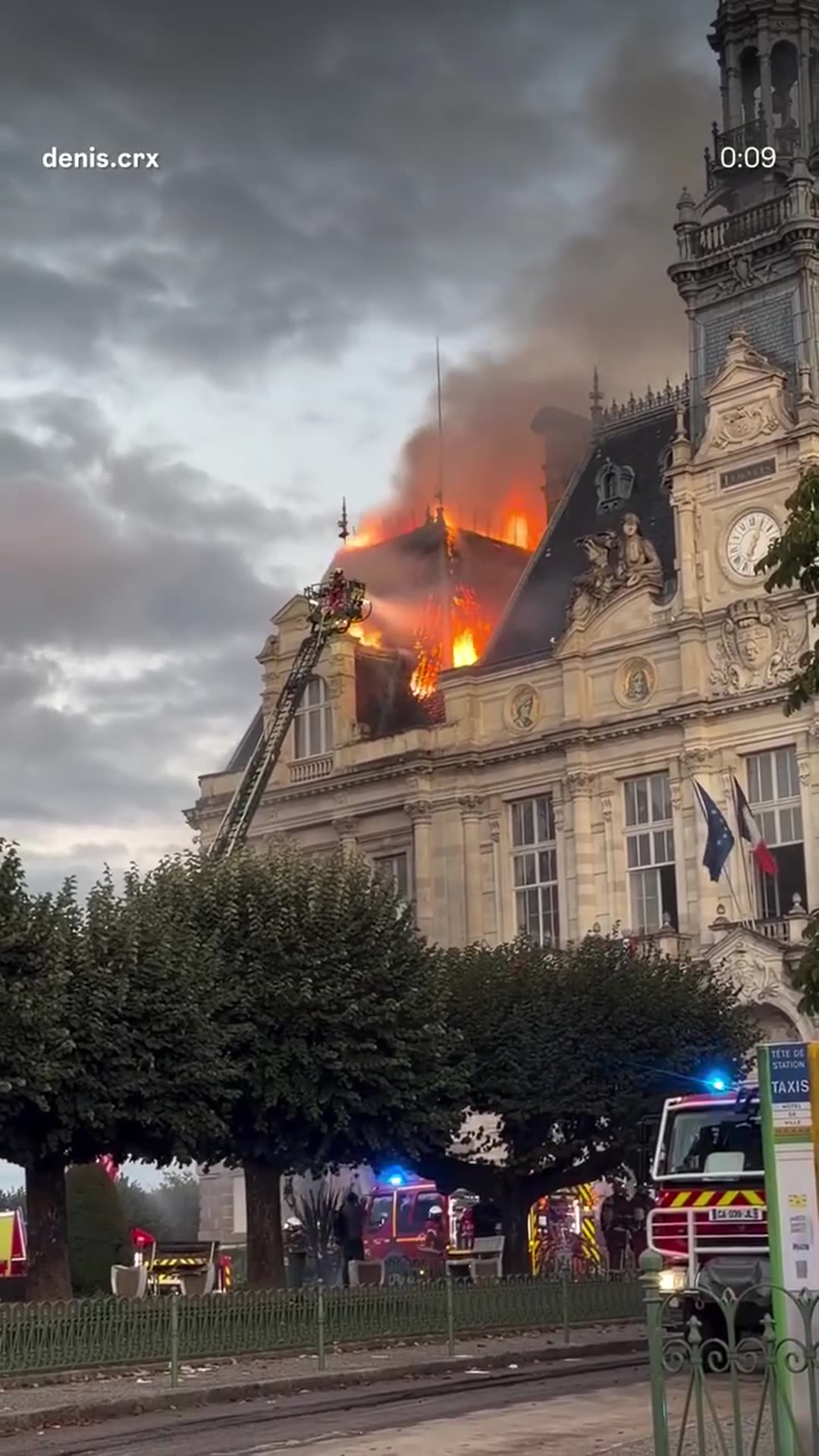 A story reshares a reel by @denis.crx showing the roof and tower of Limoges city hall burning while firefighters on an aerial ladder fight the blaze.