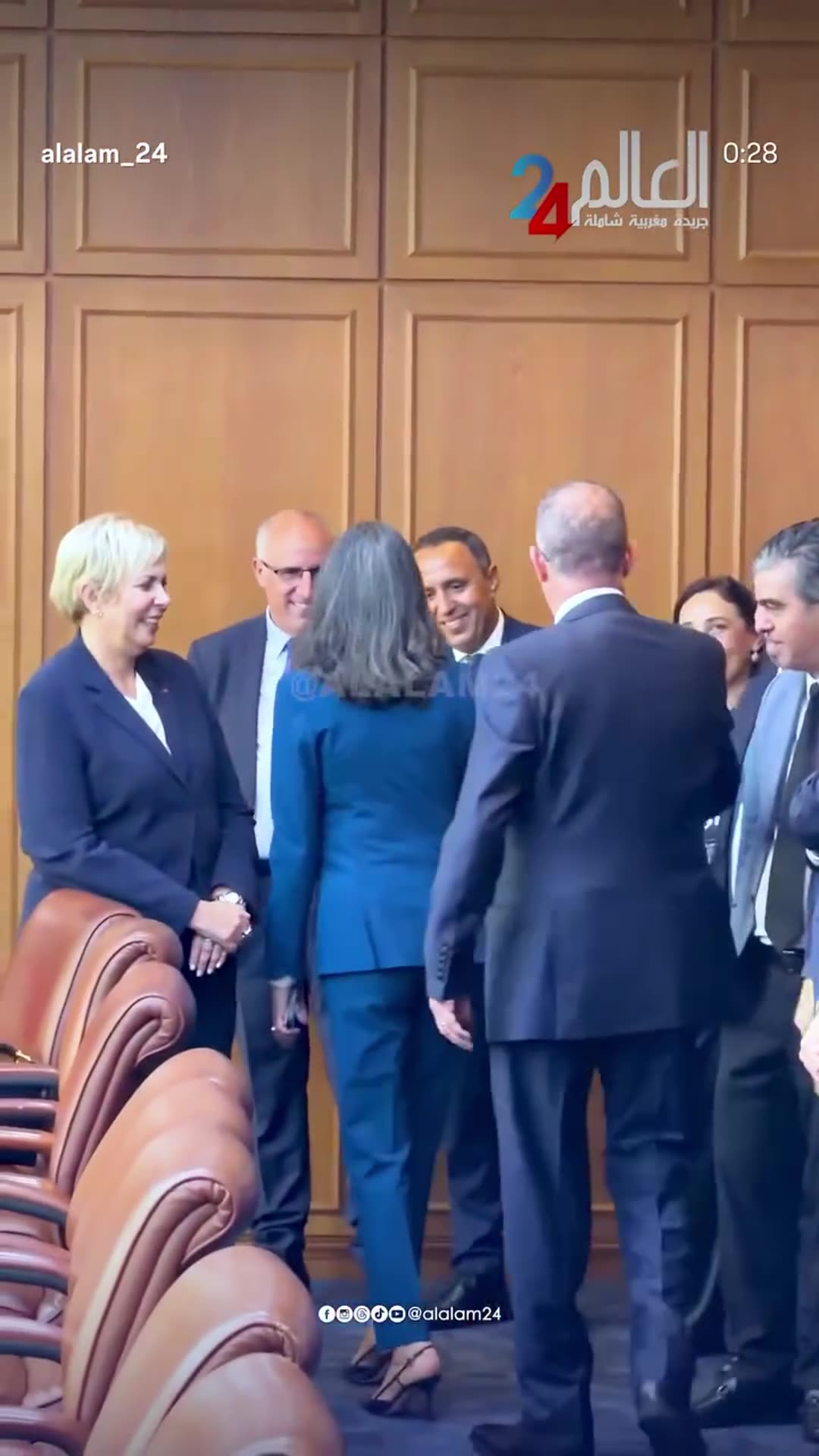 A story reshares an Alalam24 reel showing Fouzi Lekjaa and Nadia Fettah arriving at the Moroccan Ministry of Economy and Finance for the handover of powers, walking through corridors and greeting officials in the meeting room.