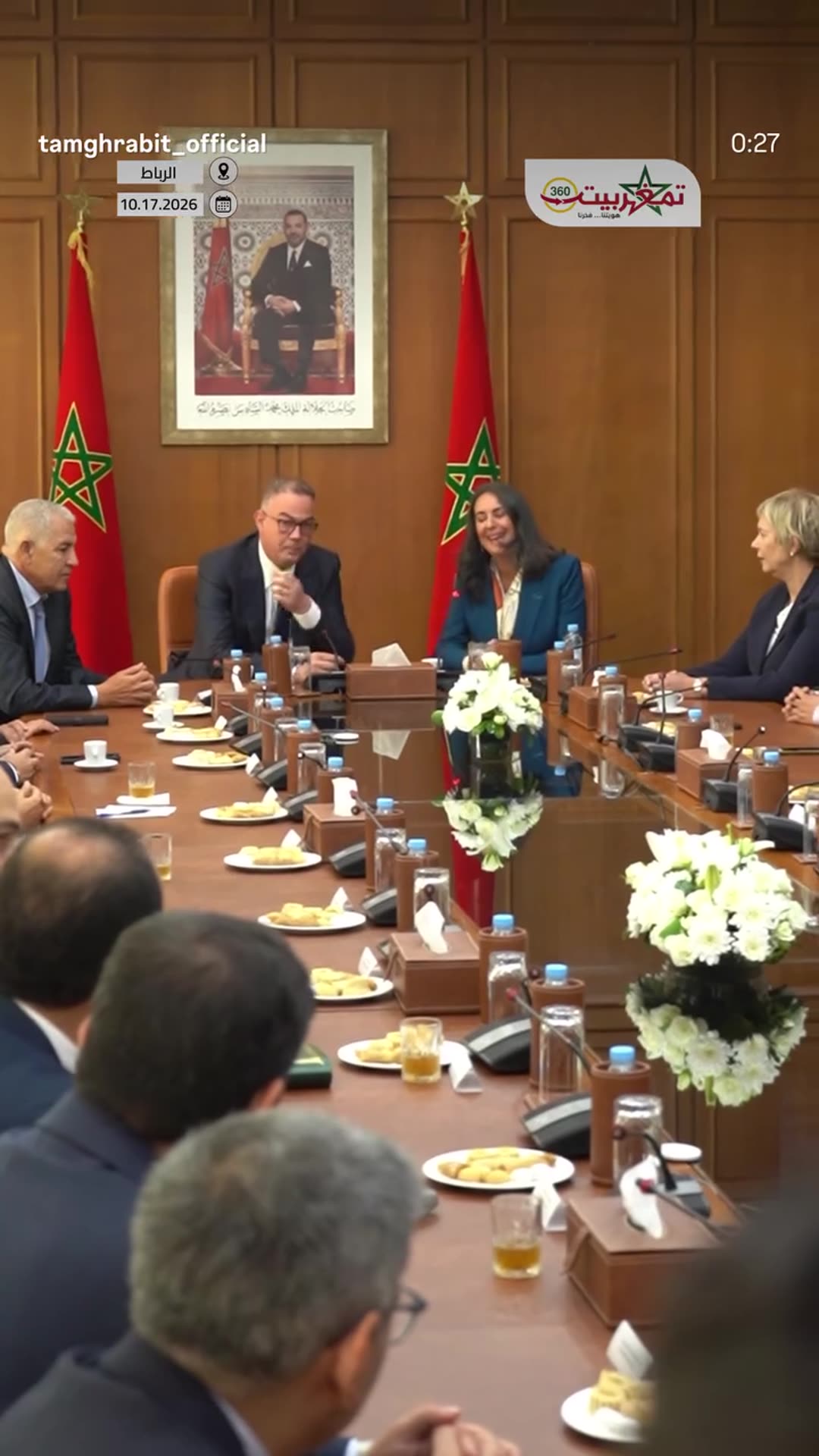 A story reshares a Tamghrabit reel of the handover ceremony at Morocco's Ministry of Economy and Finance. Nadia Fettah gives a farewell speech to staff beside the new minister Fouzi Lekjaa, and the room applauds.