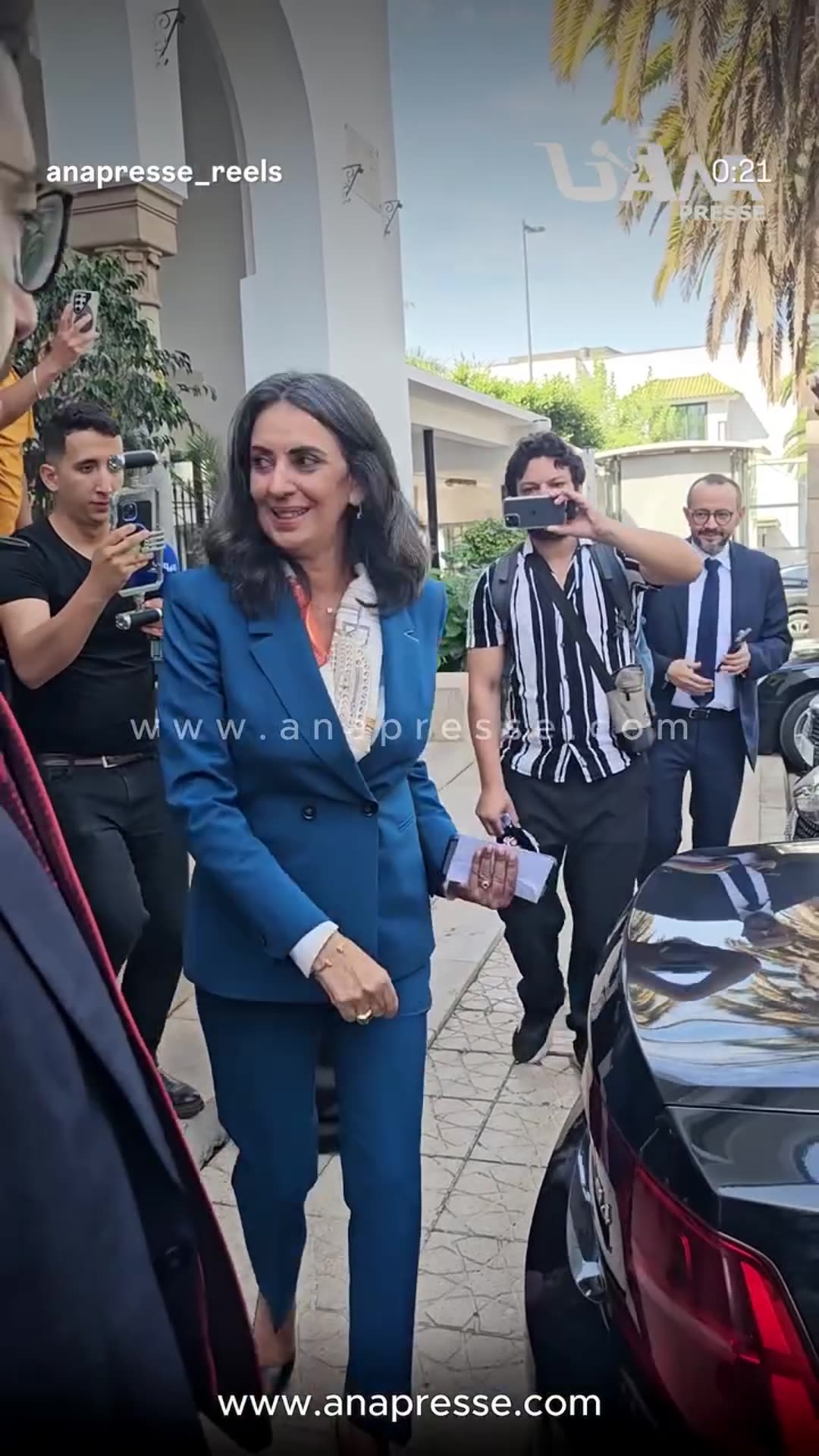 A story reshares an ANAPRESSE reel showing Nadia Fettah hugging and saying goodbye to finance ministry staff after handing over power, then leaving by car as officials crowd around.