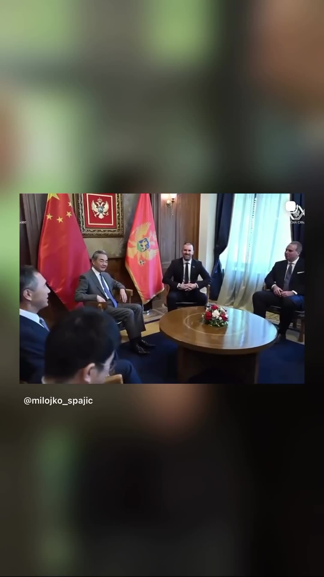 A story reshares a post by Montenegro's prime minister Milojko Spajić about talks with Chinese Foreign Minister Wang Yi, the first visit of China's top diplomat to Montenegro. The video shows the handshake greeting and the meeting with the two delegations, with Serbian-language subtitles. The linke…