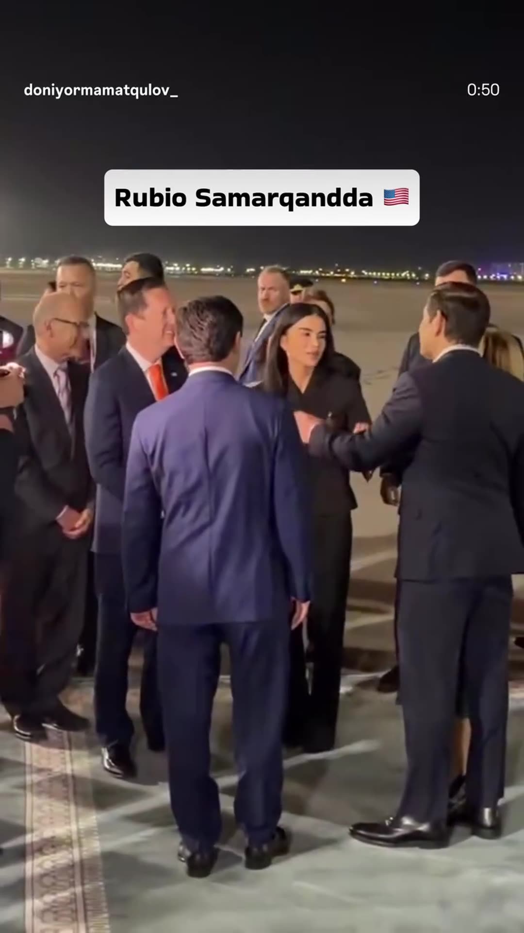 A story reshares a reel showing US Secretary of State Marco Rubio being greeted at night on the apron of Samarkand airport. The group then walks to the motorcade outside a lit building with flags.