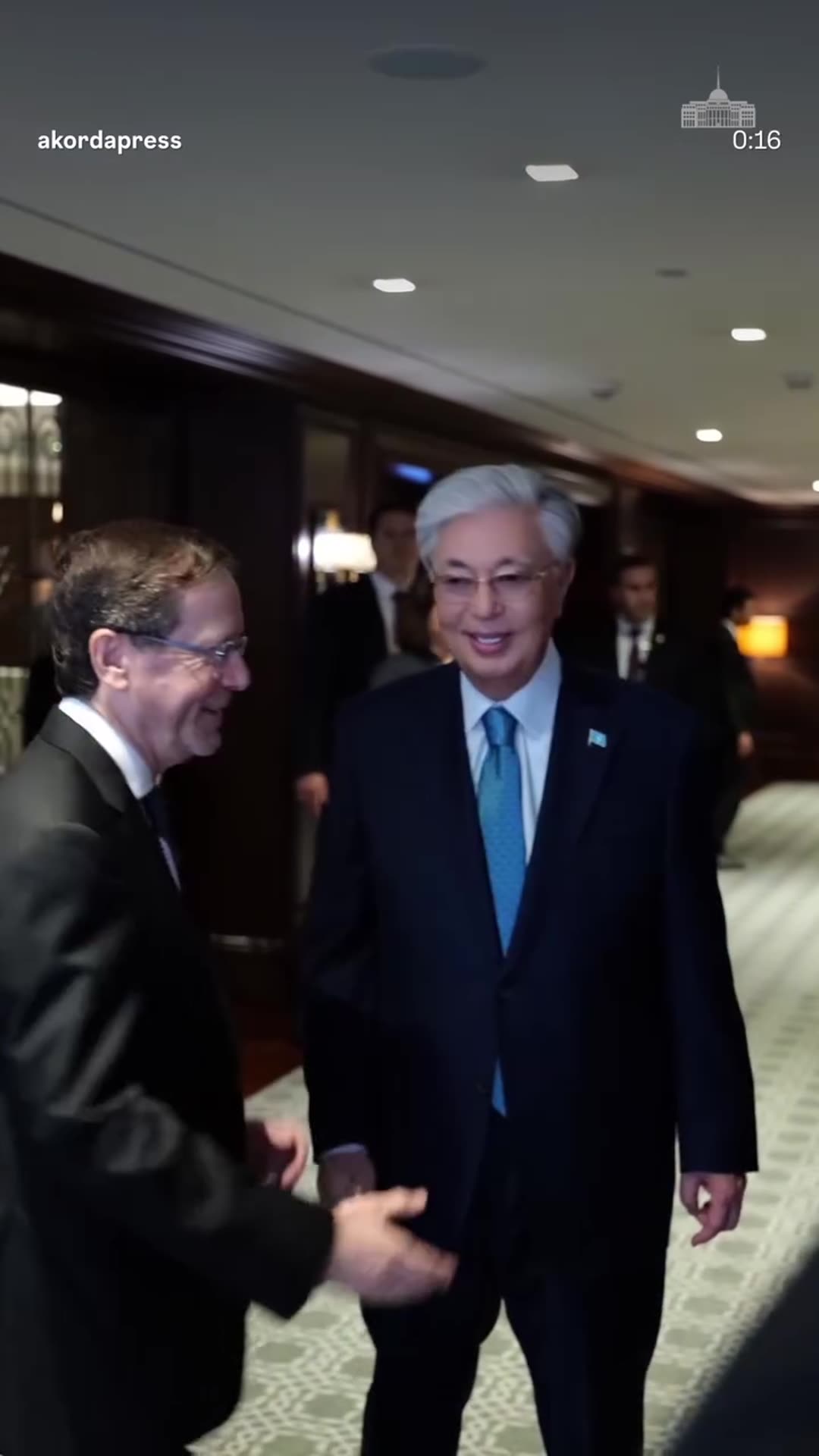 A reshared reel from the Akorda press service about a meeting with Israeli President Isaac Herzog. It shows a flag, preparations at the table, a greeting in the corridor and talks between the delegations.