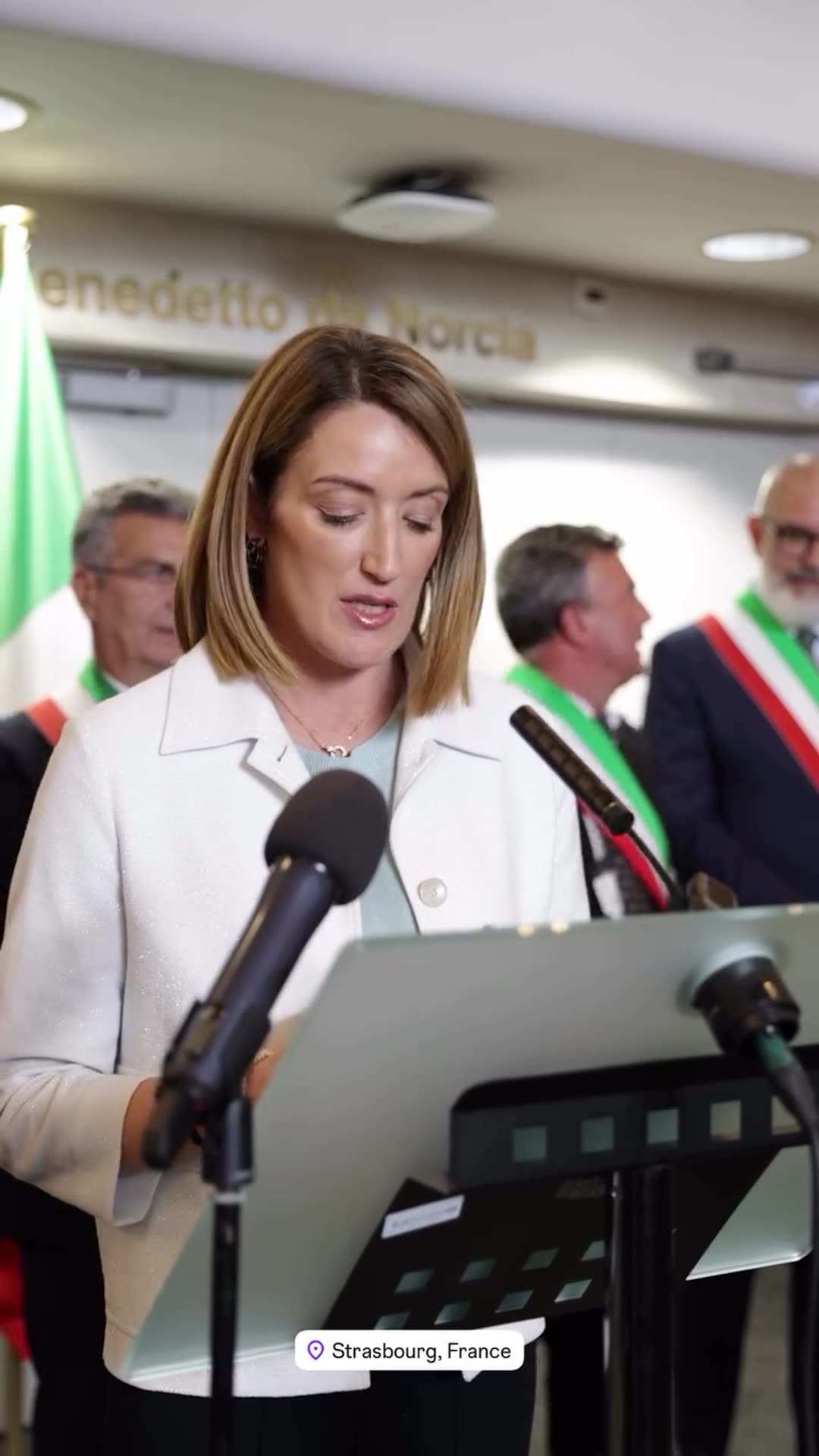 A reshared video of the unveiling of a plaque at the European Parliament in Strasbourg, followed by a speech about shared roots and values, with Benedetto da Norcia (Saint Benedict) named in it. The ceremony ends with applause and a group photo.