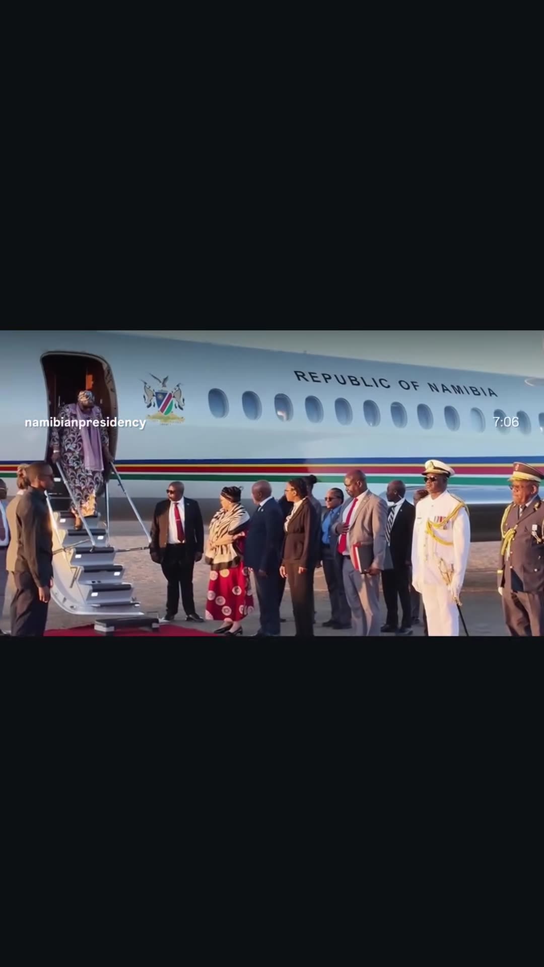 A story reshares the Namibian Presidency reel showing the President's return to Namibia after a State Visit to Angola: the presidential jet, the official welcome, a guard of honour, a cultural dance and an official's interview about the bi-national commission.