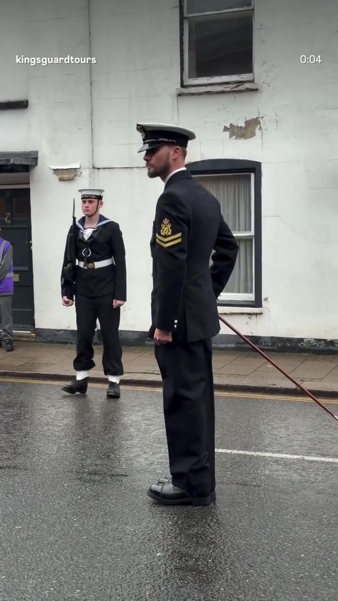 A story reshares King's Guard Tours' reel showing a Royal Navy marching sailor with a cane and sailors at attention on a wet Windsor street, preparing for the Oman State Visit.