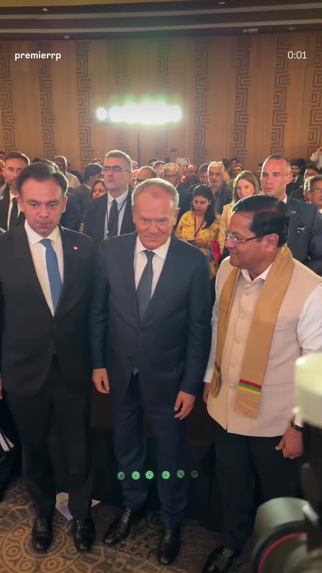 A story reshares a Polish PM Chancellery reel showing Prime Minister Donald Tusk walking through a crowded hall, shaking hands and posing with an Indian official at the Polish-Indian Business Forum.