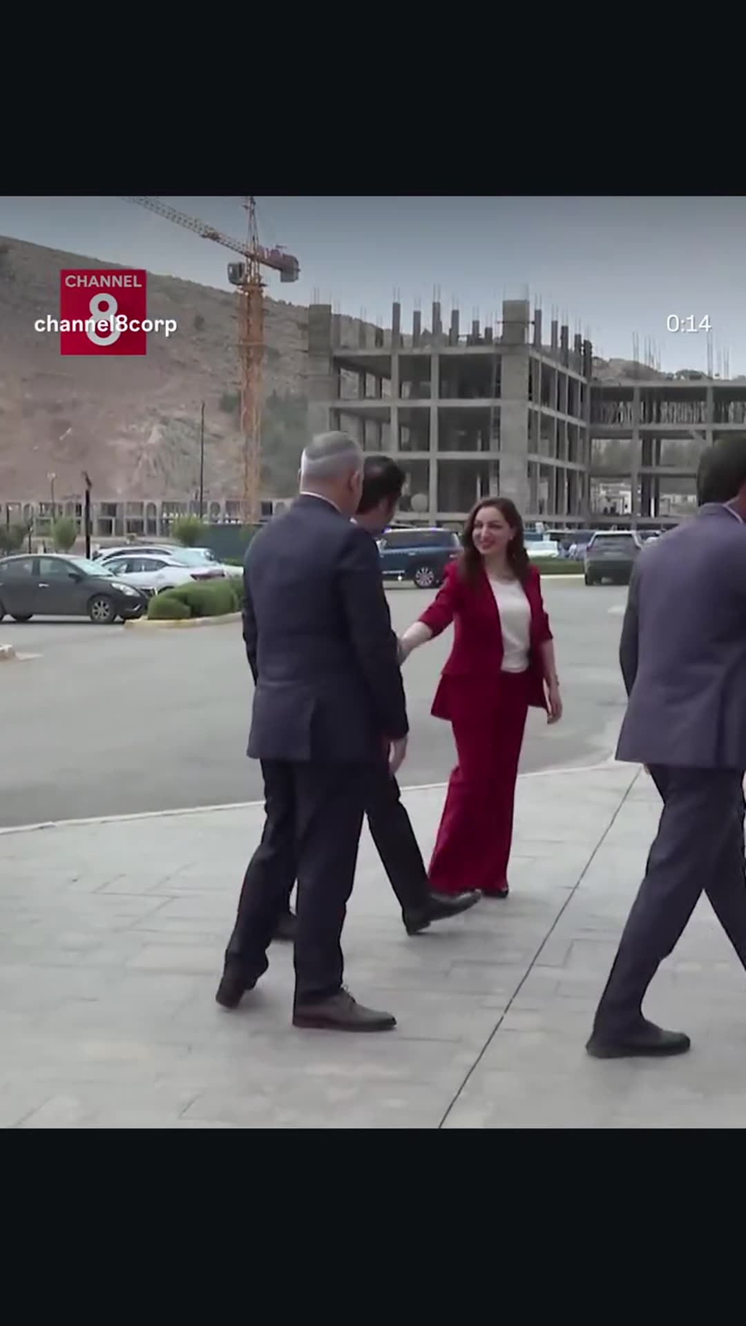 A story reshares a Channel 8 reel in which officials in suits walk across a plaza and enter a building, greeted by a woman in red and followed by a reporter and camera crews. The caption says the Kurdish politician Qubad Talabani arrived at the Rapareen administration and speaks to the Channel 8 re…