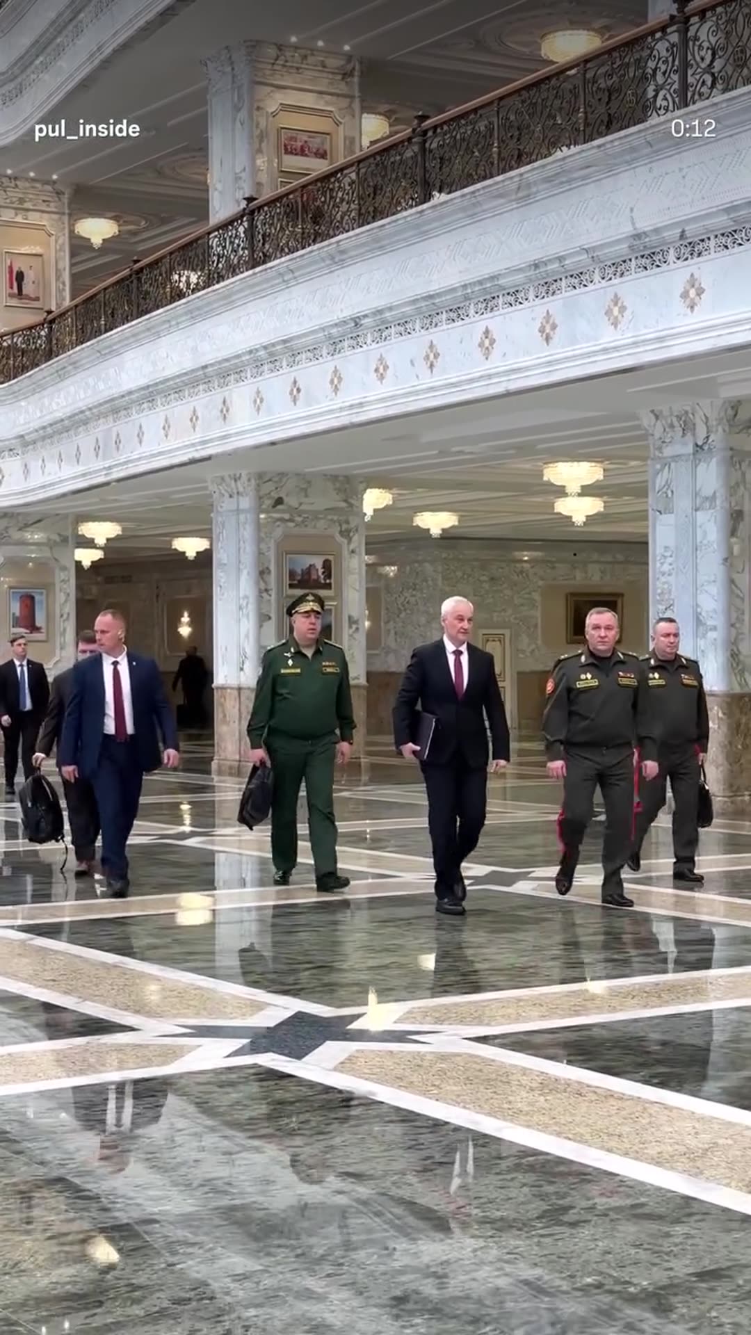 A story reshares a @pul_inside reel showing officials in suits and military uniforms walking through a grand marble hall of the Palace of Independence and then greeting each other in a bright corridor. The reel ends with a 'to be continued' line.