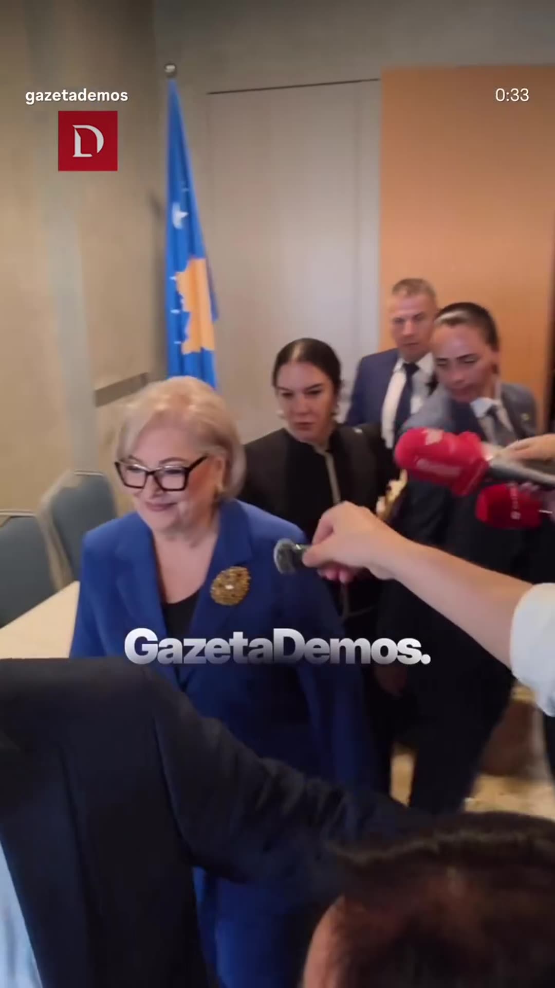 Reposted Gazeta Demos reel following a woman in a blue suit as she leaves an international conference hall, surrounded by reporters and escorts, and is helped into a black car outside. Reporters ask her about the Specialized Court law and get no answer.