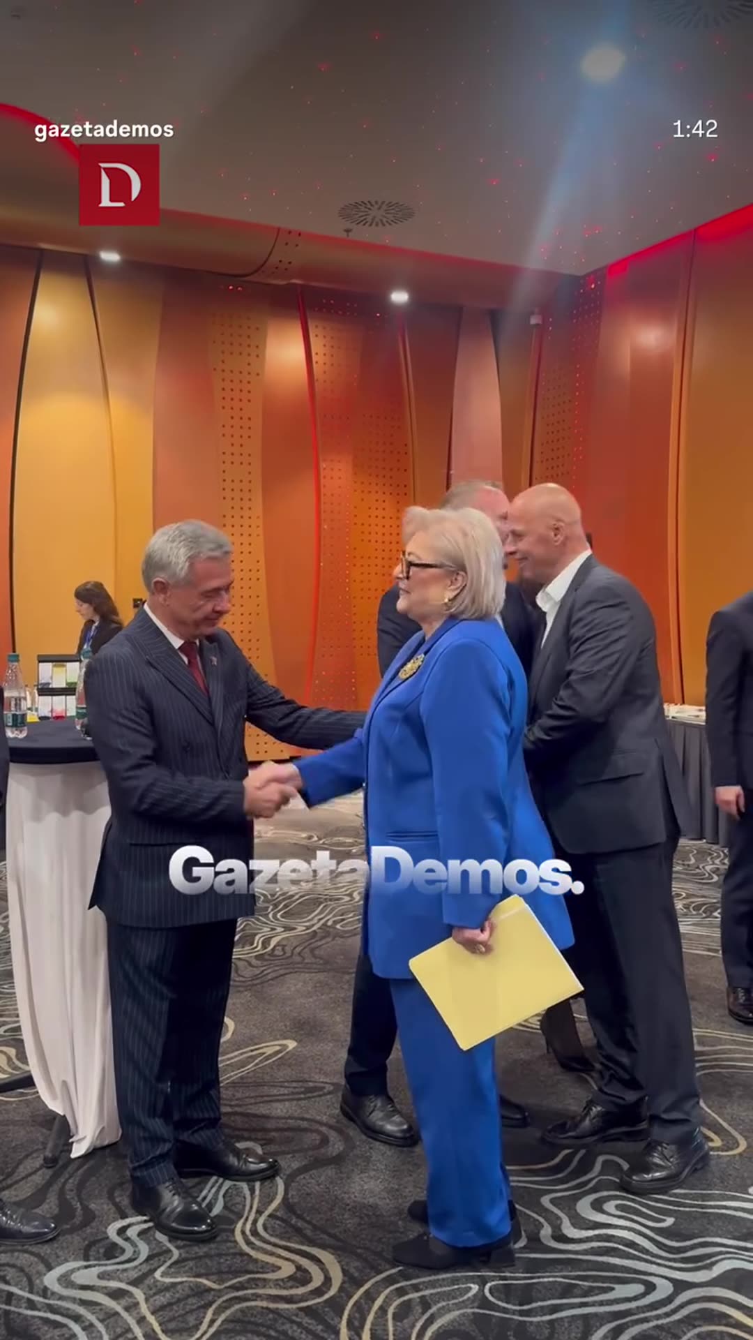 Gazeta Demos footage reshared to a story. It shows well-wishers lining up in a hotel conference venue to greet and congratulate the new president of the Constitutional Court before an international conference.
