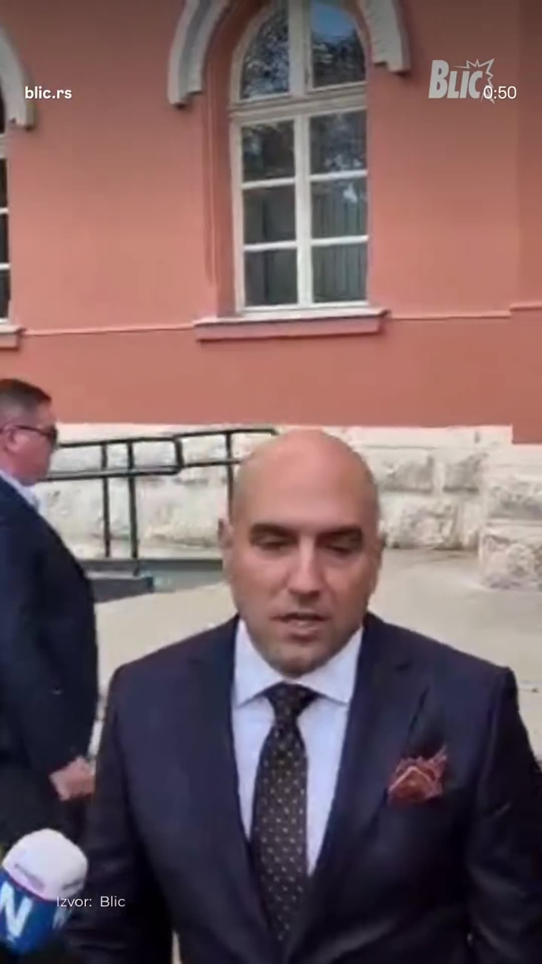 A story reshares a Blic reel showing the former mayor of Niš leaving the Higher Court after a preparatory hearing, while her lawyer tells reporters that she contested the indictment and that the main trial is scheduled for December.