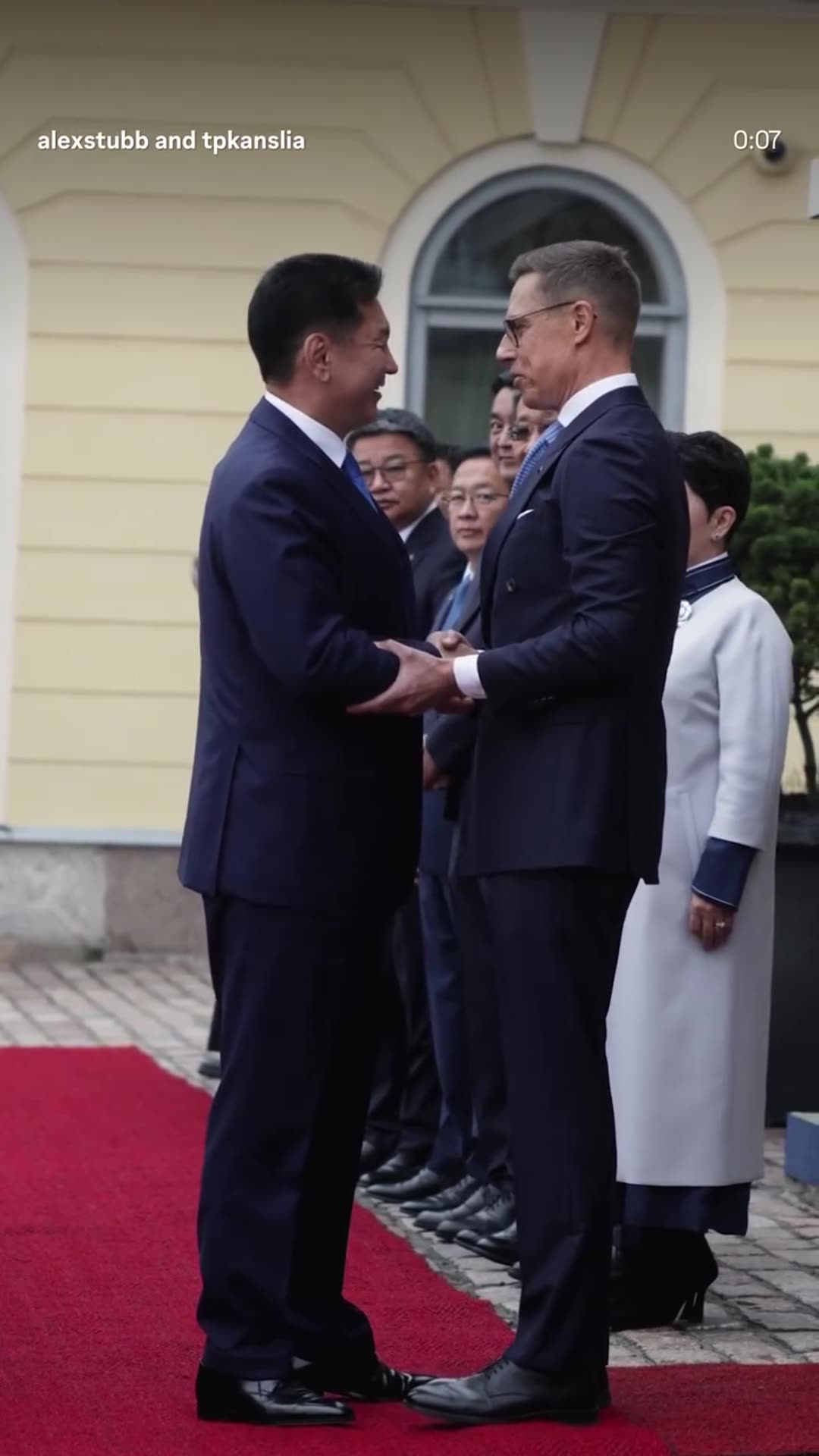 A reshared reel of Finnish President Alexander Stubb welcoming Mongolian President Ukhnaa Khurelsukh on a red carpet outside the Presidential Palace in Helsinki. The guest steps from a car, and the two leaders shake hands and embrace.
