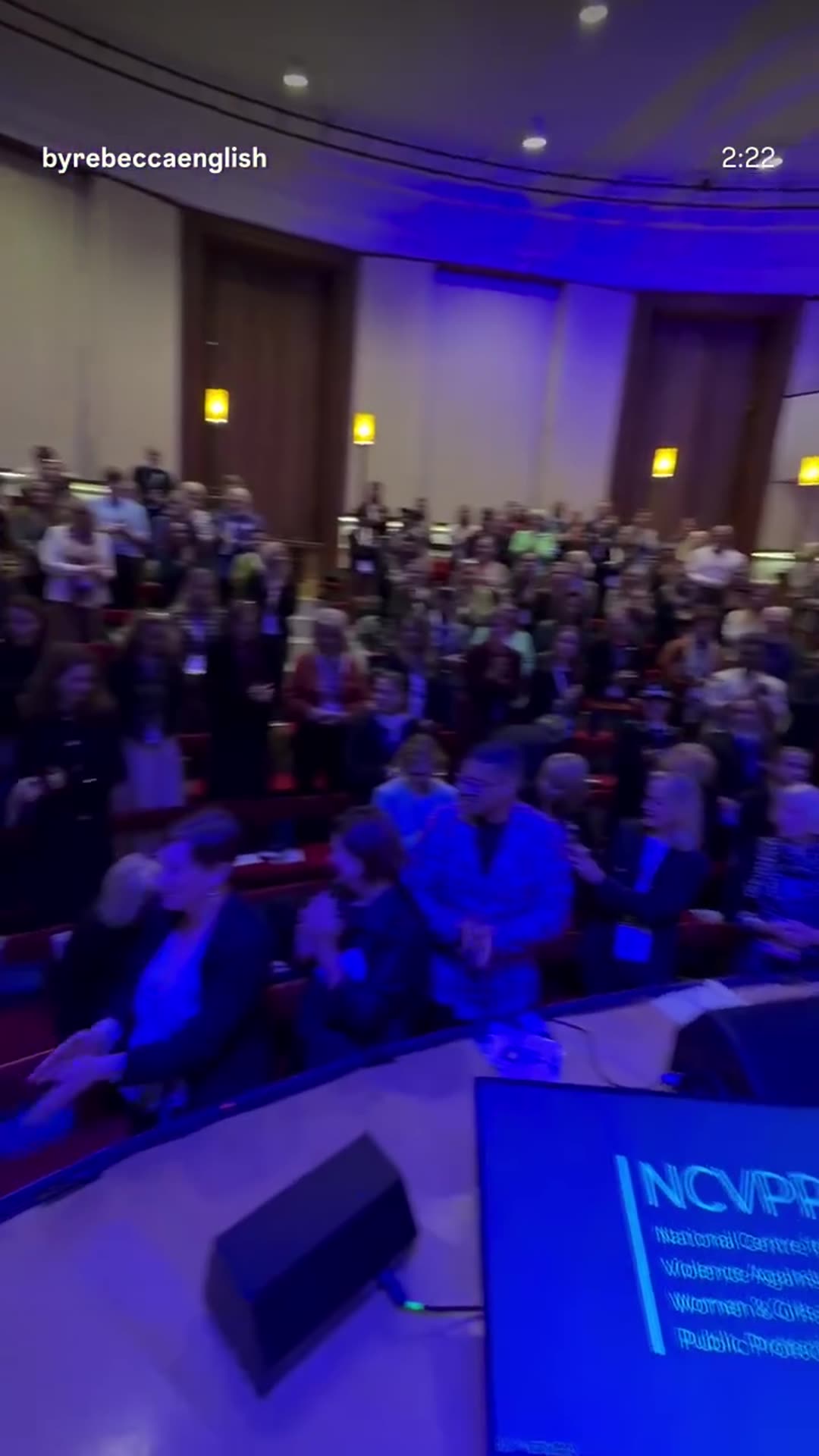 A story reshare of Rebecca English's reel showing Queen Camilla at the Ending Violence Against Women and Girls summit. She arrives, is applauded, speaks seated on stage praising survivors as the real heroes, and then meets campaigners backstage.