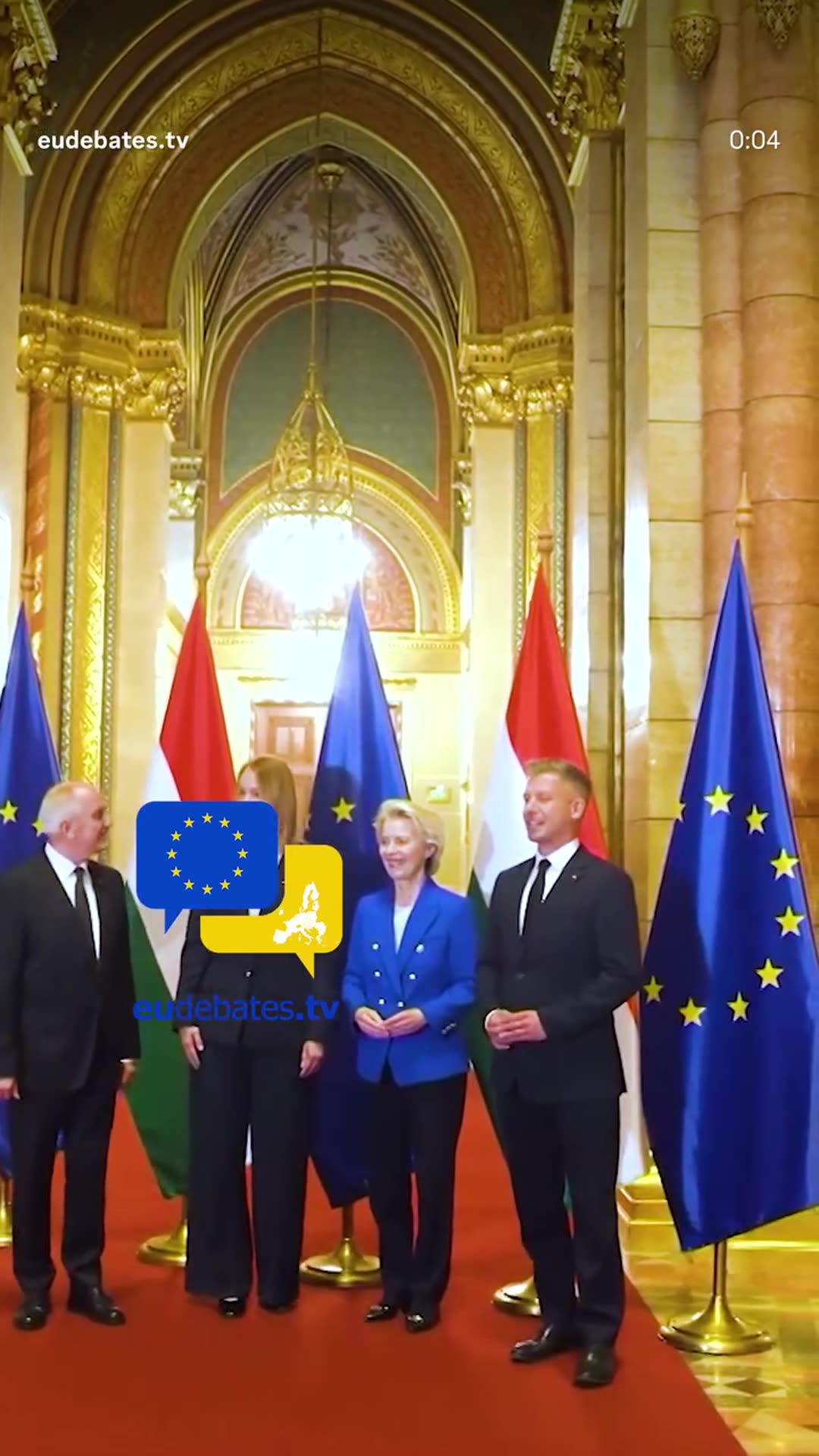 A reshared eudebates.tv reel showing the official welcome of European Commission President Ursula von der Leyen at the Hungarian Parliament, with handshakes and a group photo in front of EU and Hungarian flags.