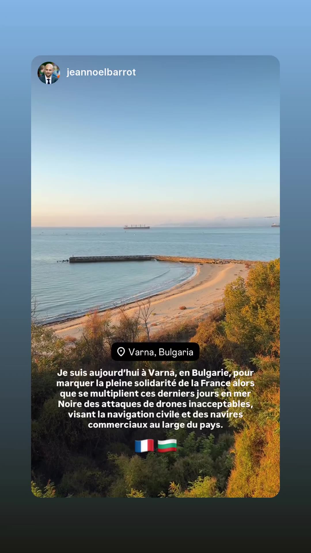 A story reshares a video from Jean-Noël Barrot's account. It shows a sunlit beach and sea at Varna, Bulgaria, with a French-language text saying he is there to show France's full solidarity with Bulgaria amid repeated drone attacks in the Black Sea on civilian shipping and commercial vessels.
