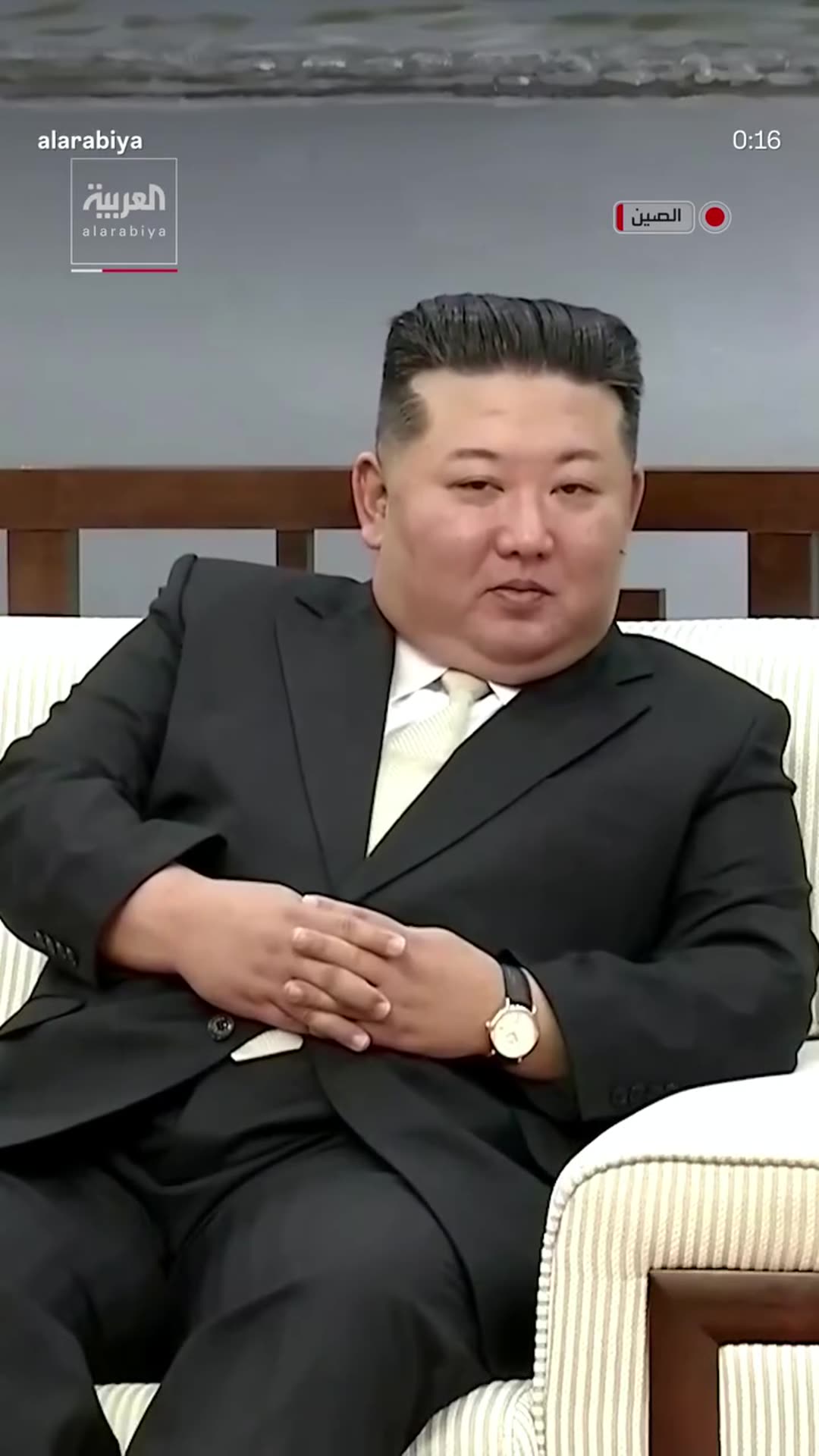 A story reshares Al Arabiya's reel with highlights of Kim Jong Un's surprise visit to China: he lays a wreath at a war memorial, tours an exhibition, meets Chinese political adviser Wang Huning, and waves to people on a bridge.