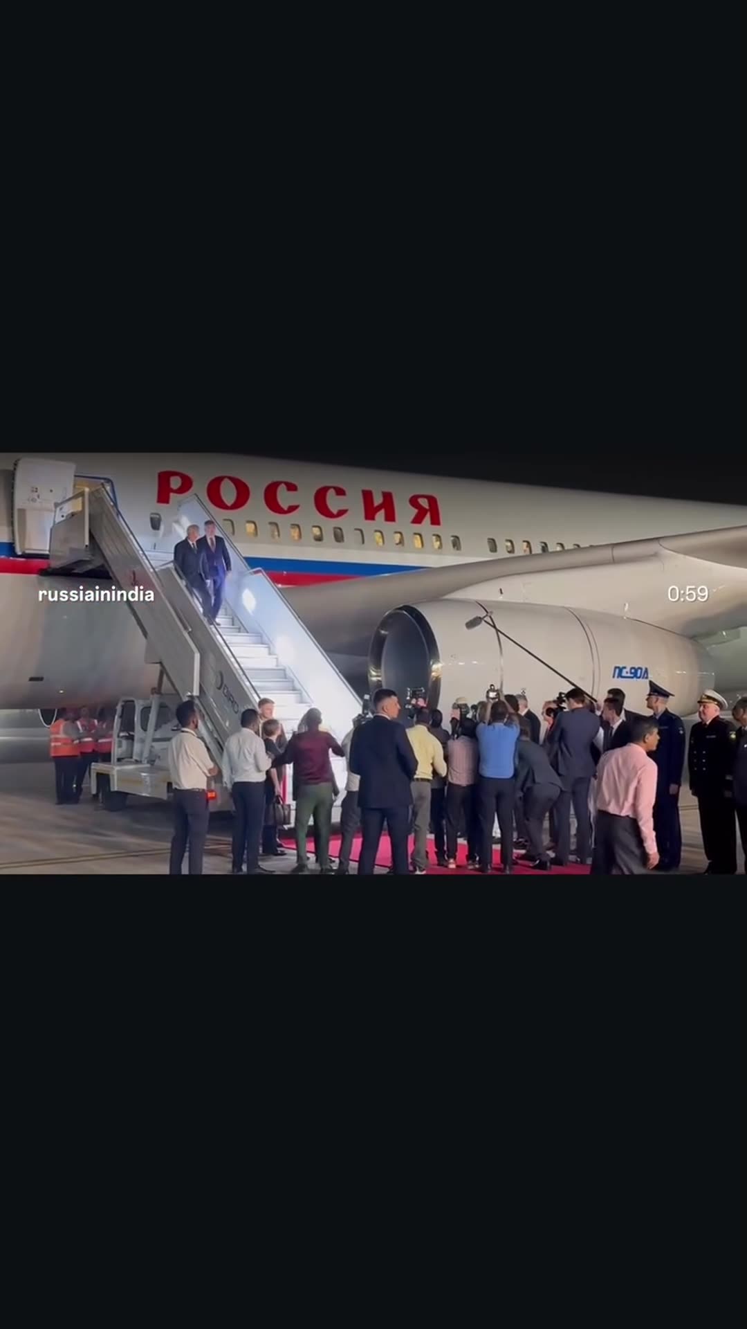 A reposted story sharing a reel by the Russian Embassy in India about the arrival of the State Duma chairman at night in New Delhi for the 12th BRICS Parliamentary Forum. A Russian government plane stands by a red carpet while a delegation and press greet the guest.