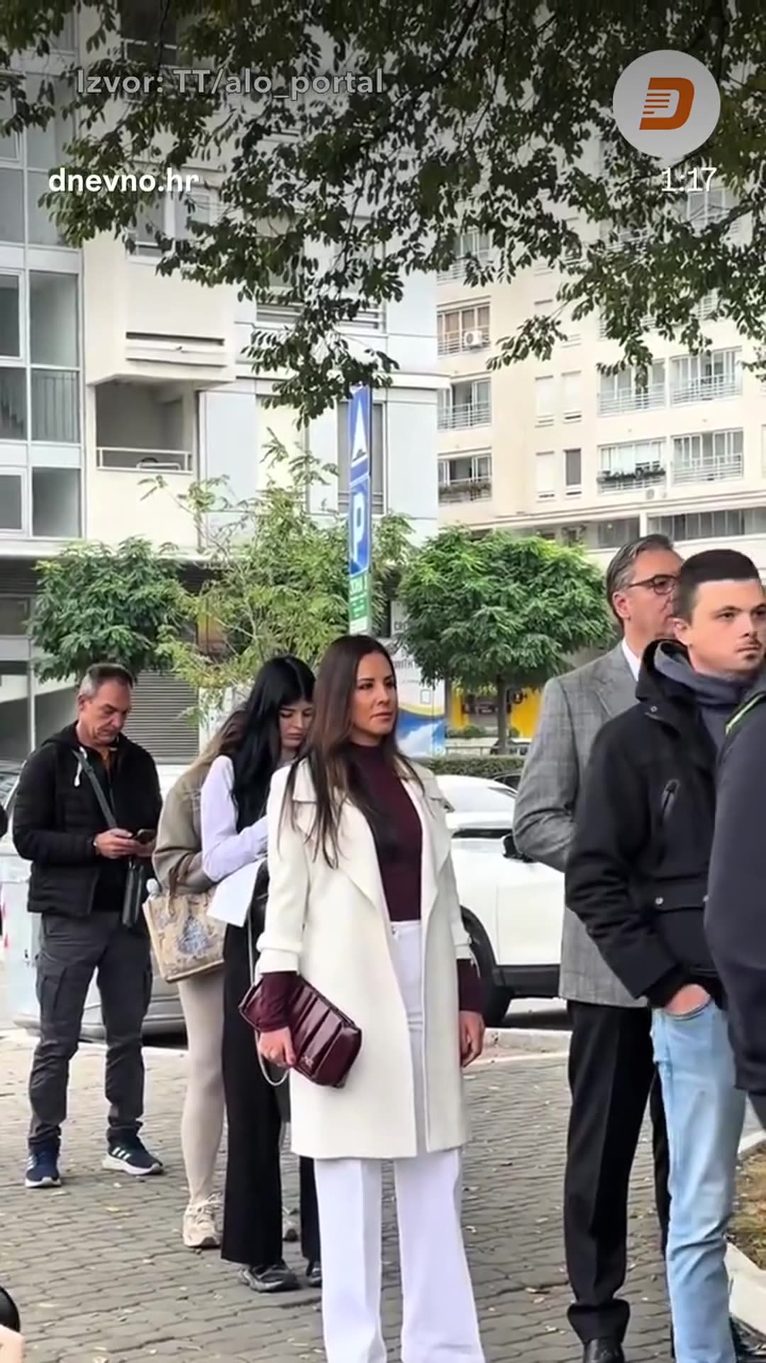 A story resharing a Dnevno.hr reel about the Serbian elections. It shows people queueing at polling stations, including a man named in the caption as Aleksandar Vučić, and a night-time queue outside a consulate abroad where food is handed out.