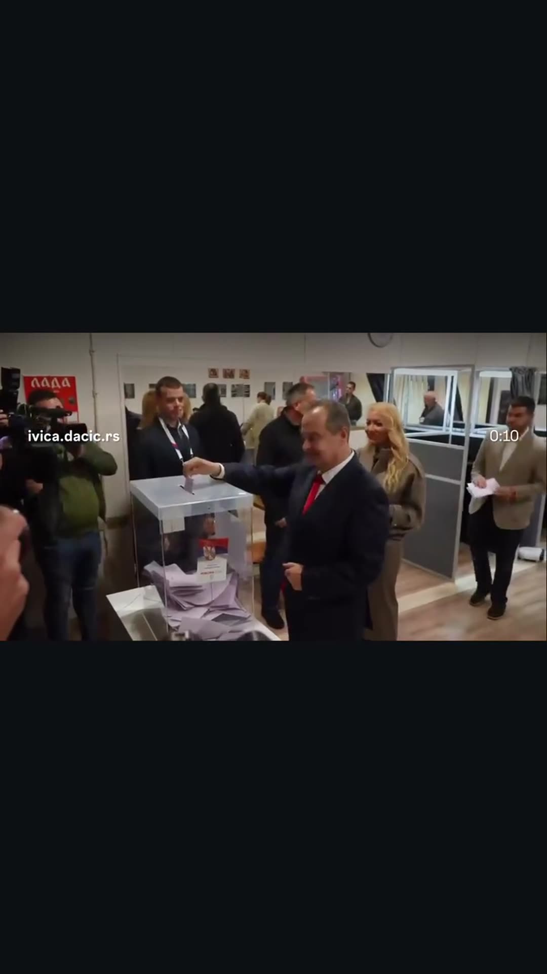 A story reshares a reel from @ivica.dacic.rs showing a man in a suit and a blonde woman casting ballots at a polling station while cameras film. The original caption is a campaign-style slogan, "Za Faktor stabilnosti!" (For the Stability Factor).