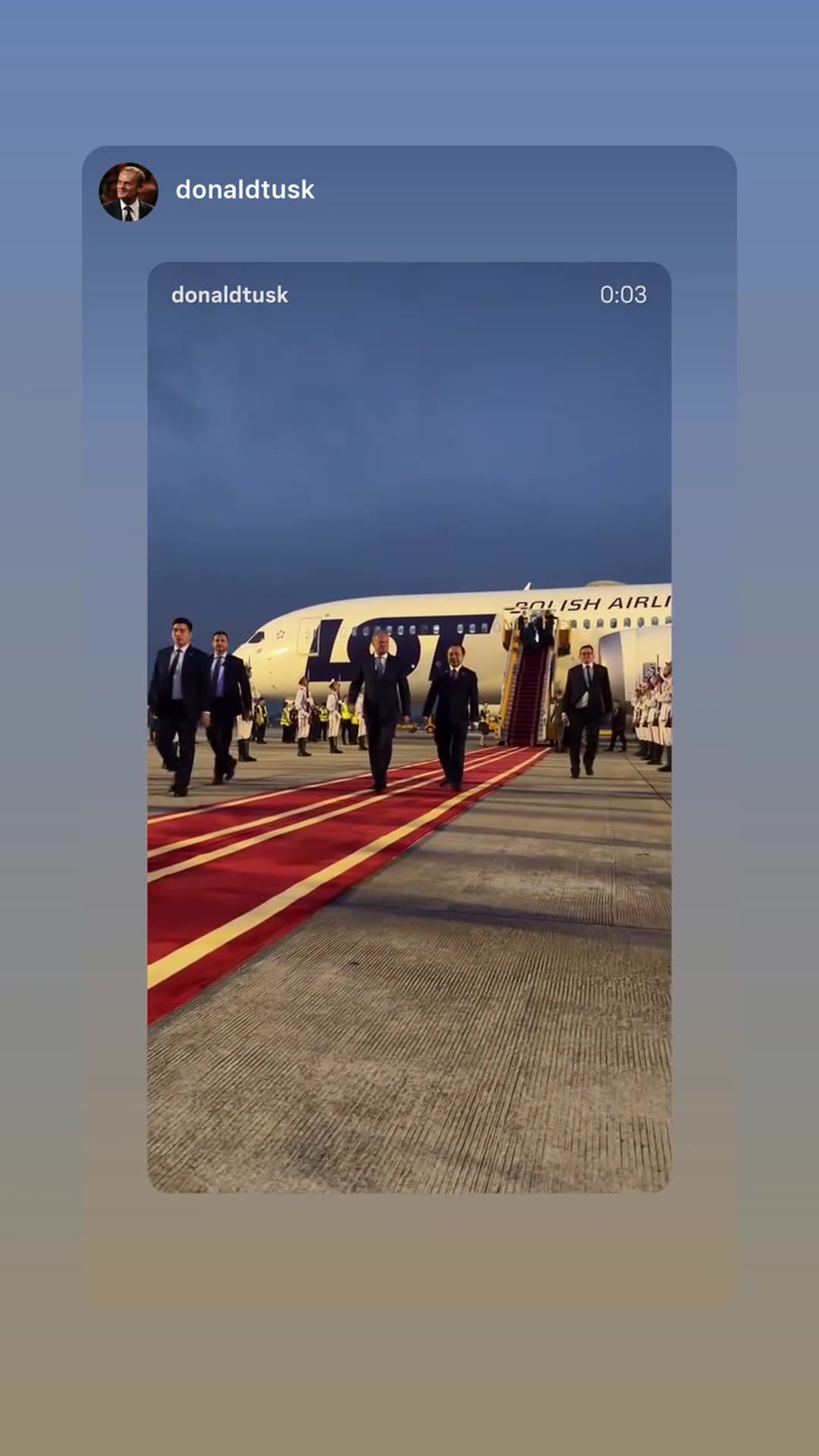 A story reshares a video from @donaldtusk's account showing a delegation walking down a red carpet after getting off a LOT Polish Airlines plane at dusk, with an honor guard lined up on the tarmac.