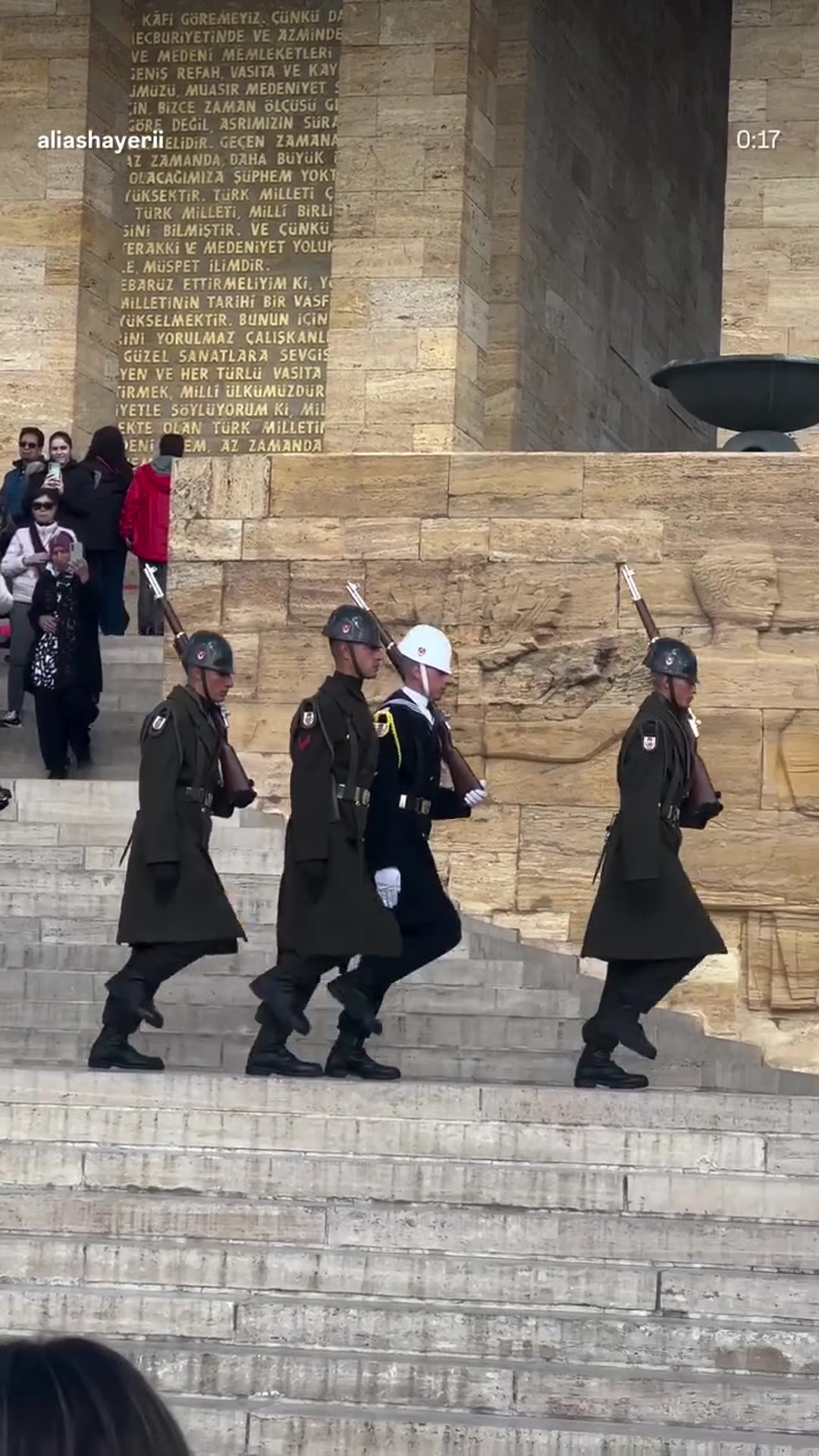 A story reshares Ali Ashayeri's reel of the changing of the guard at Anıtkabir, the mausoleum of Atatürk in Ankara. Soldiers march down the stone steps past the relief carvings while visitors film them.