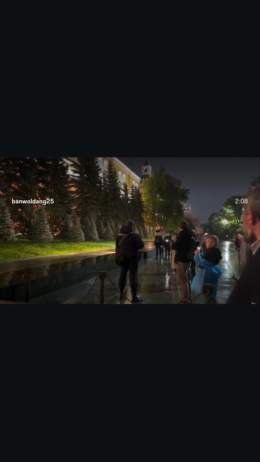 A story reshares a reel of the changing of the guard at the Eternal Flame by the Kremlin wall on a rainy evening, with spectators watching and filming.