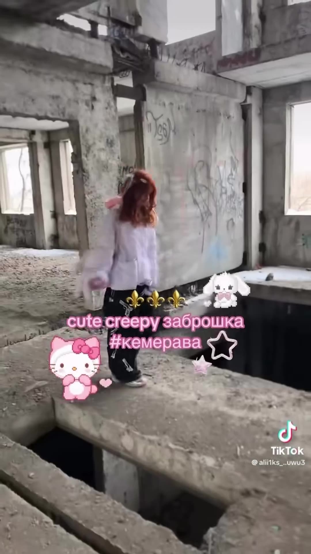 A story reshares a TikTok video of a person in a light jacket walking through an abandoned, graffiti-covered concrete building, with pink Hello Kitty stickers and the text 'cute creepy заброшка #кемерава'.