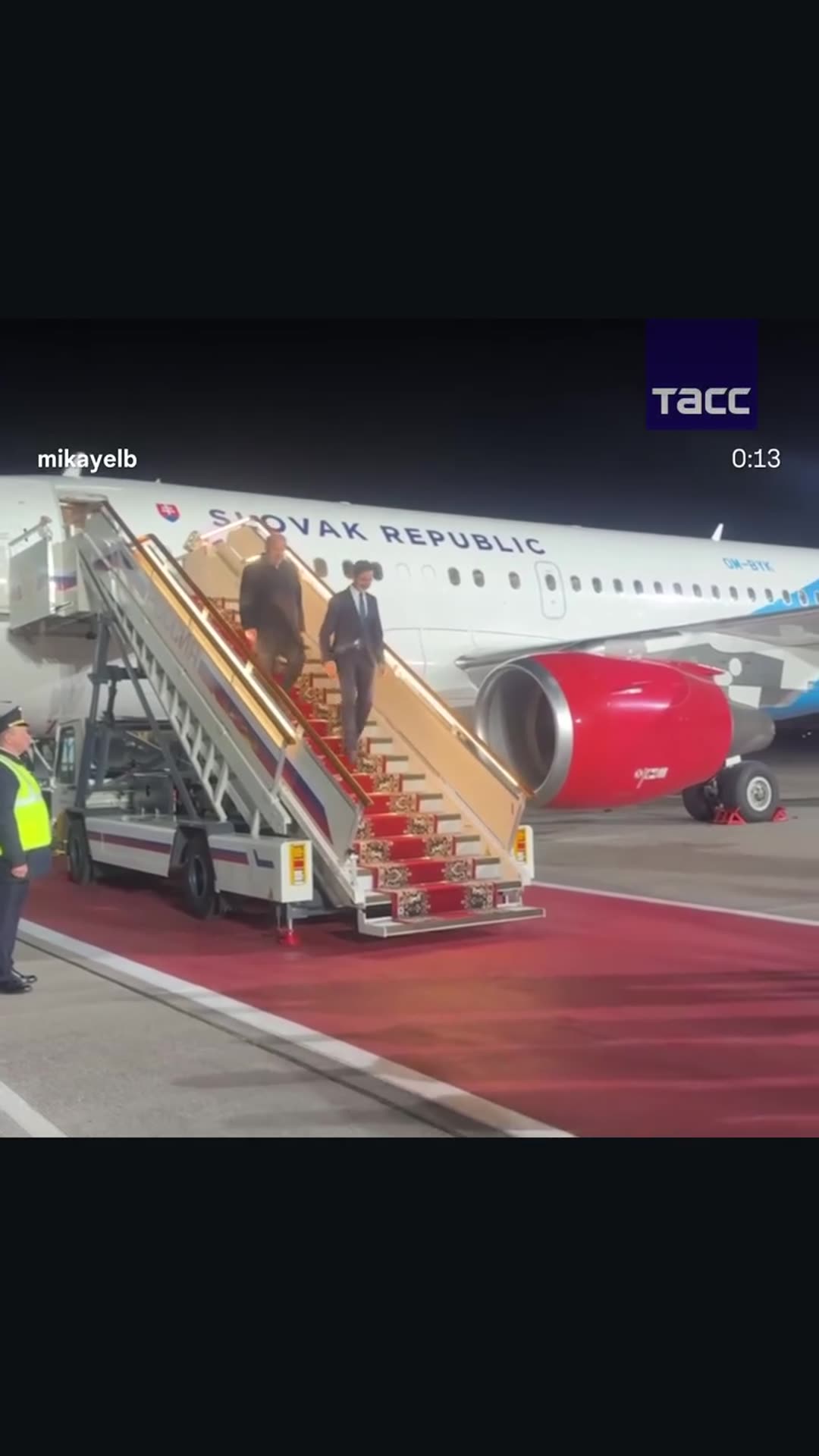 A story reshares Mika Badalyan's reel with TASS footage of a Slovak delegation, led per the caption by the foreign minister, stepping off a Slovak Republic plane at night and being greeted on a red carpet. The caption says they arrived in Moscow for talks on resuming cooperation with Russia.