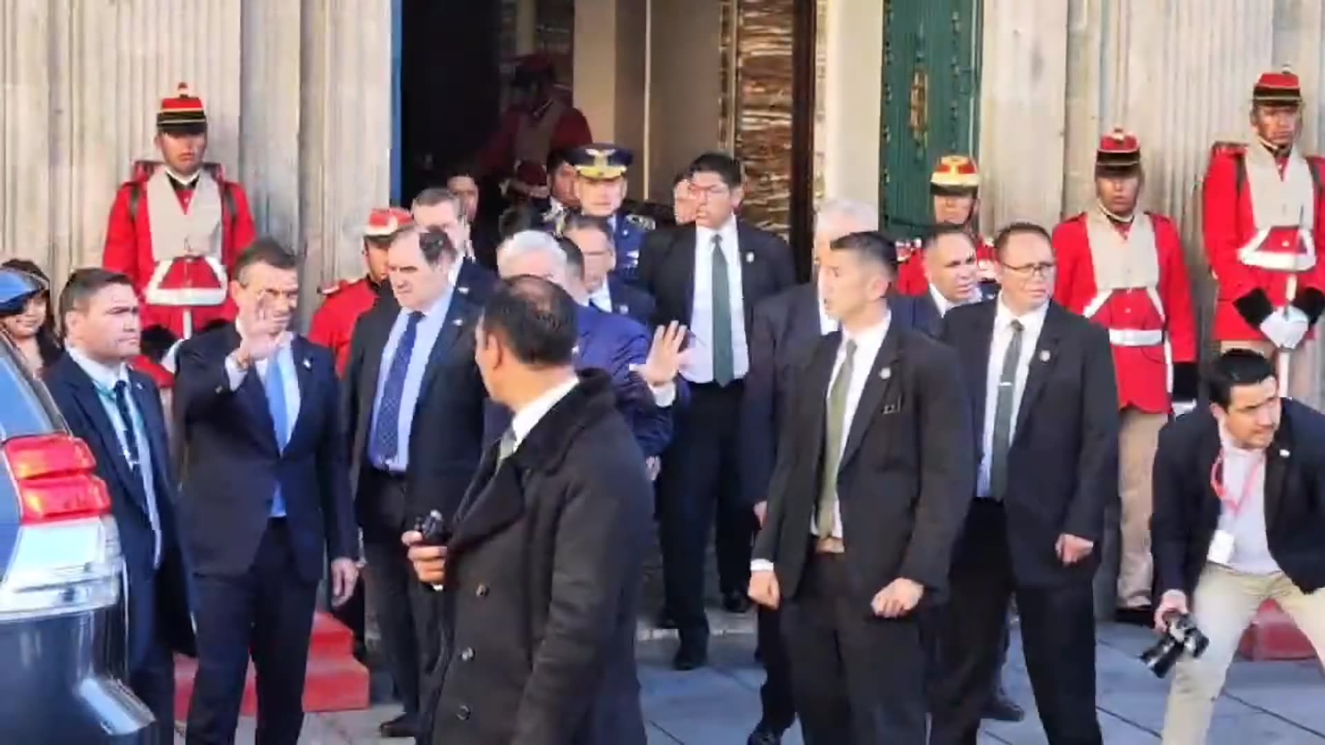 A reshared Correo del Sur reel shows officials leaving Bolivia's Government Palace after a bilateral meeting with Chile. The delegation walks out past honor guards, gets into SUVs, and a motorcade with a small Chilean flag on a car leaves. The caption says a citizen shouted "¡Mar para Bolivia!" at…