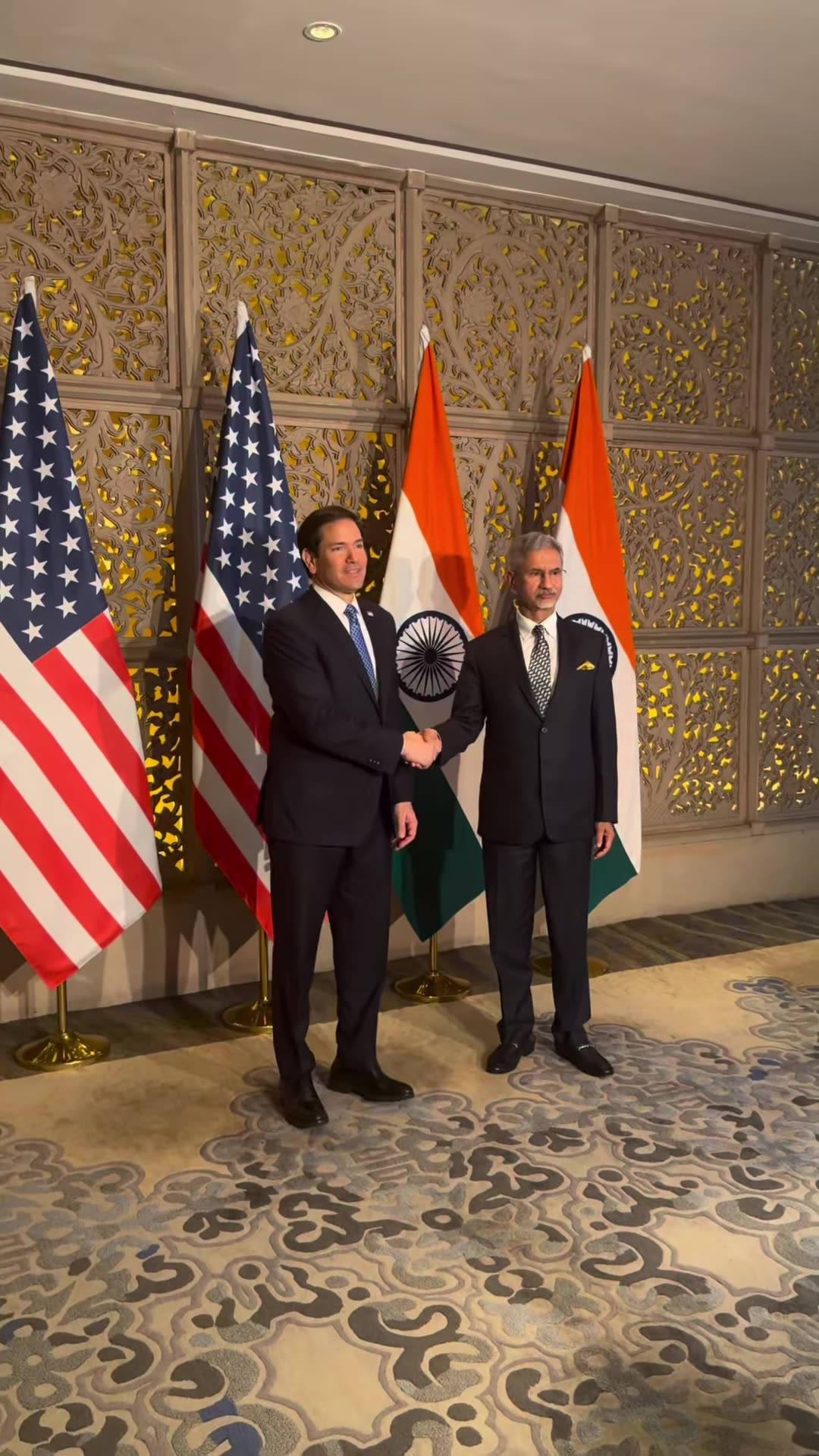 A reshared reel by S. Jaishankar showing his meeting in Mumbai with the UAE Deputy Prime Minister and Foreign Minister and the US Secretary of State: a handshake in front of flags, a walk along a corridor, and a group standing in a sitting room.