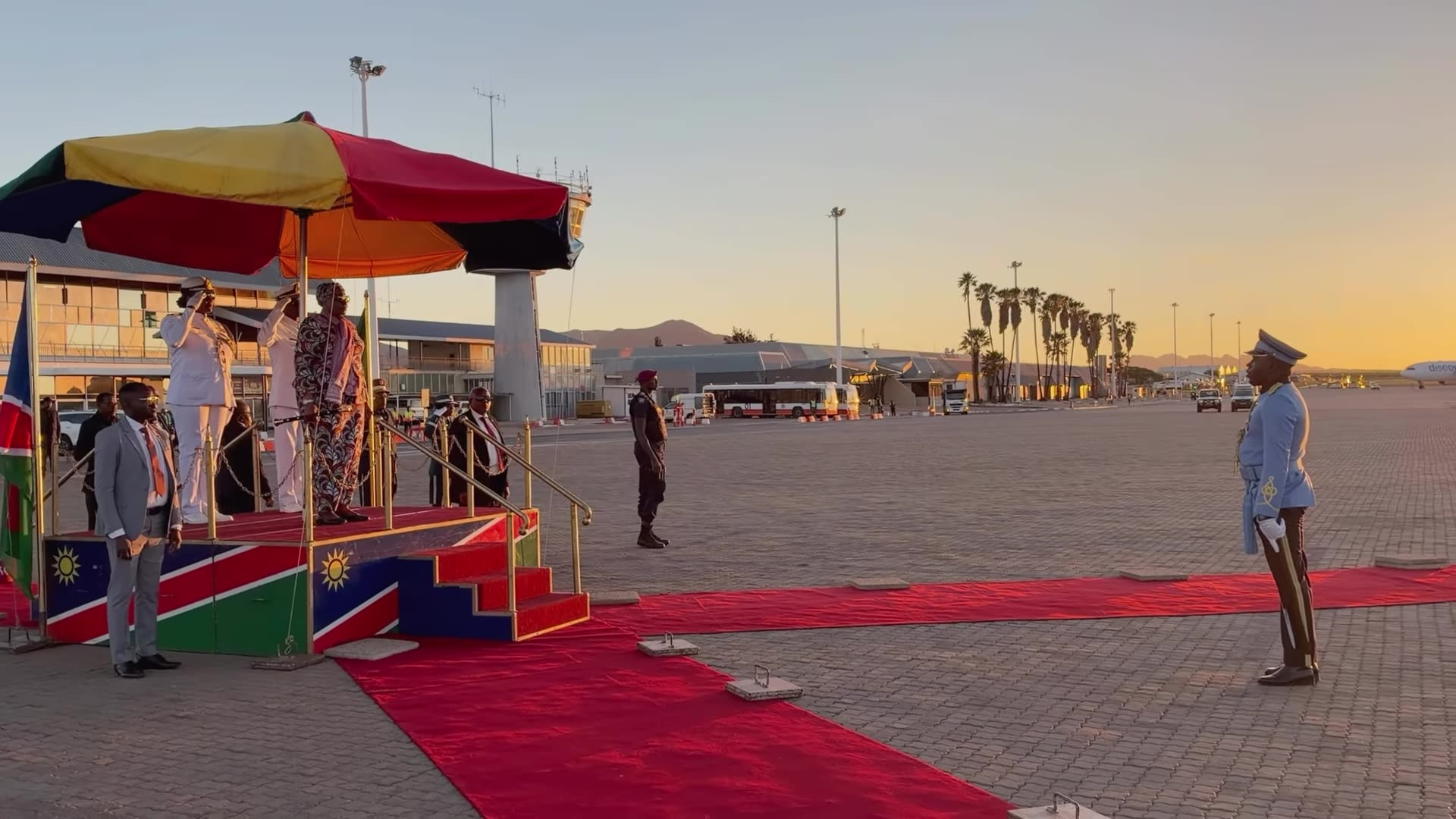 A reshared official reel from @namibianpresidency showing President Netumbo Nandi-Ndaitwah's homecoming at the airport after a State Visit to Angola, with a guard of honour, welcome by officials, a traditional dance and an interview at the end.