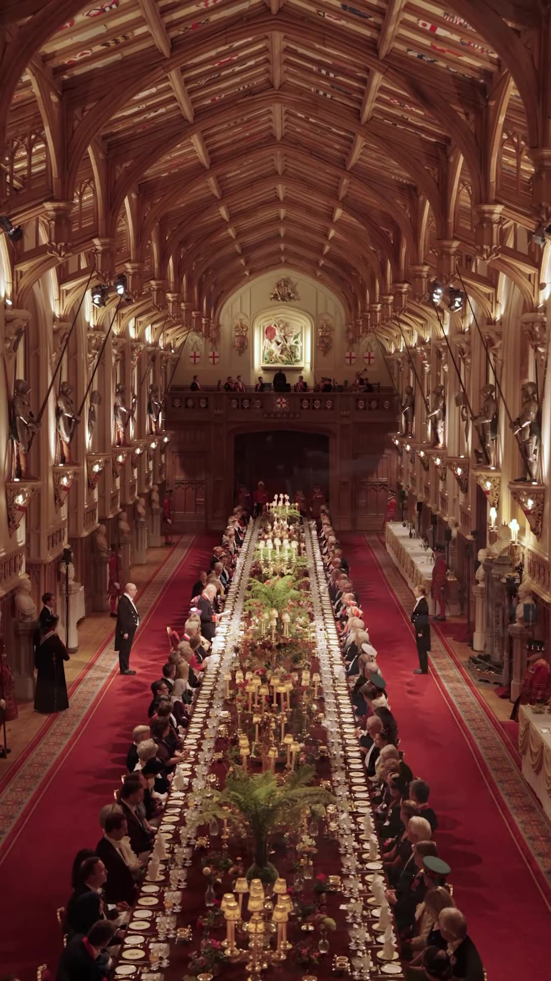 A reshared reel from the Prince and Princess of Wales showing preparations for and moments of the state banquet at Windsor Castle for the Sultan of Oman's State Visit: guests arriving, the table settings, the chef plating food, a harpist, the King's speech and a view of the long banquet hall.