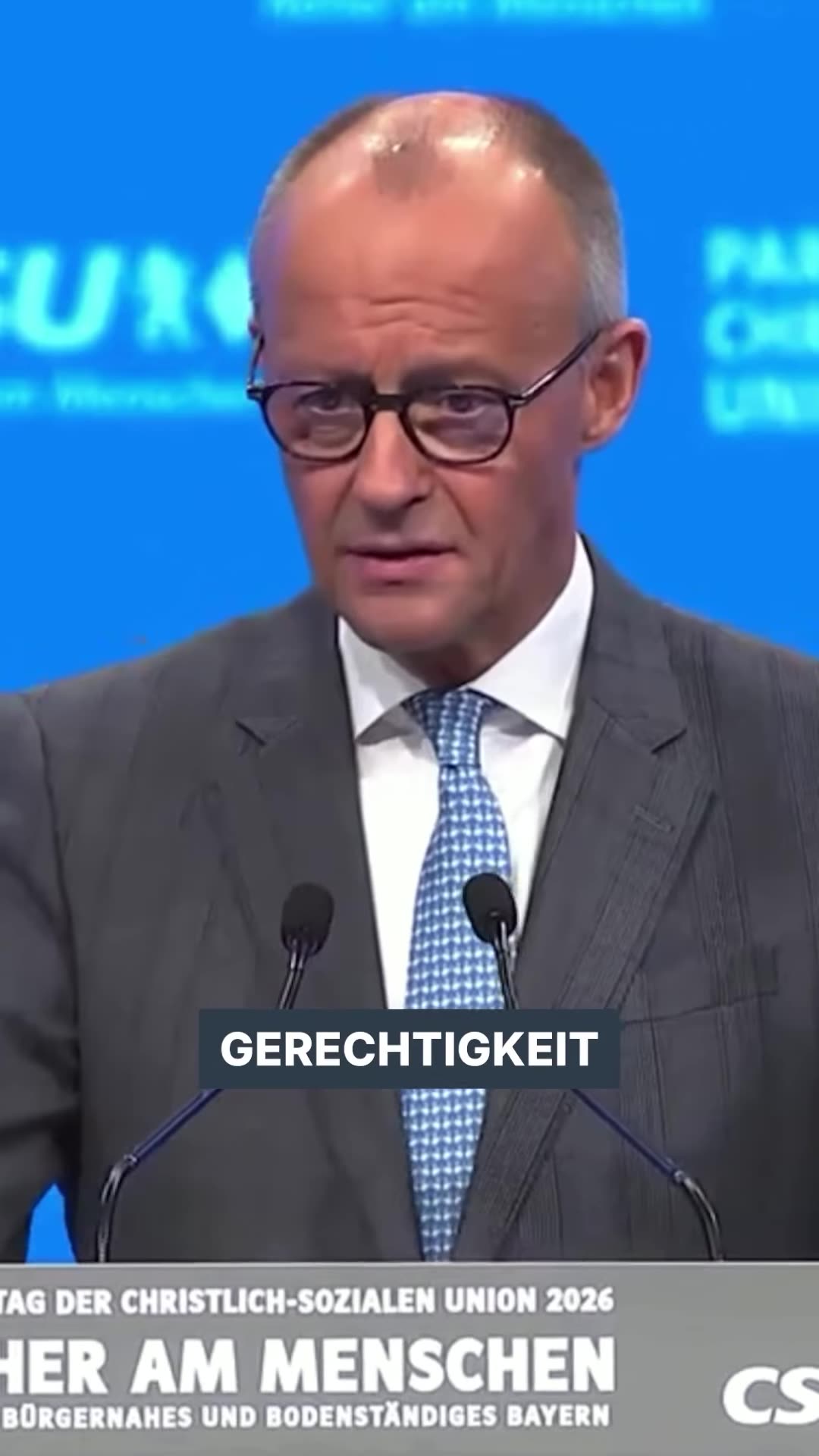 A repost of a CDU reel with a speech by Friedrich Merz at the CSU party conference in which he says justice has always been the Union's core and defines it as equality of opportunity, fairness of performance and fairness between generations, rejecting redistribution and expropriation.
