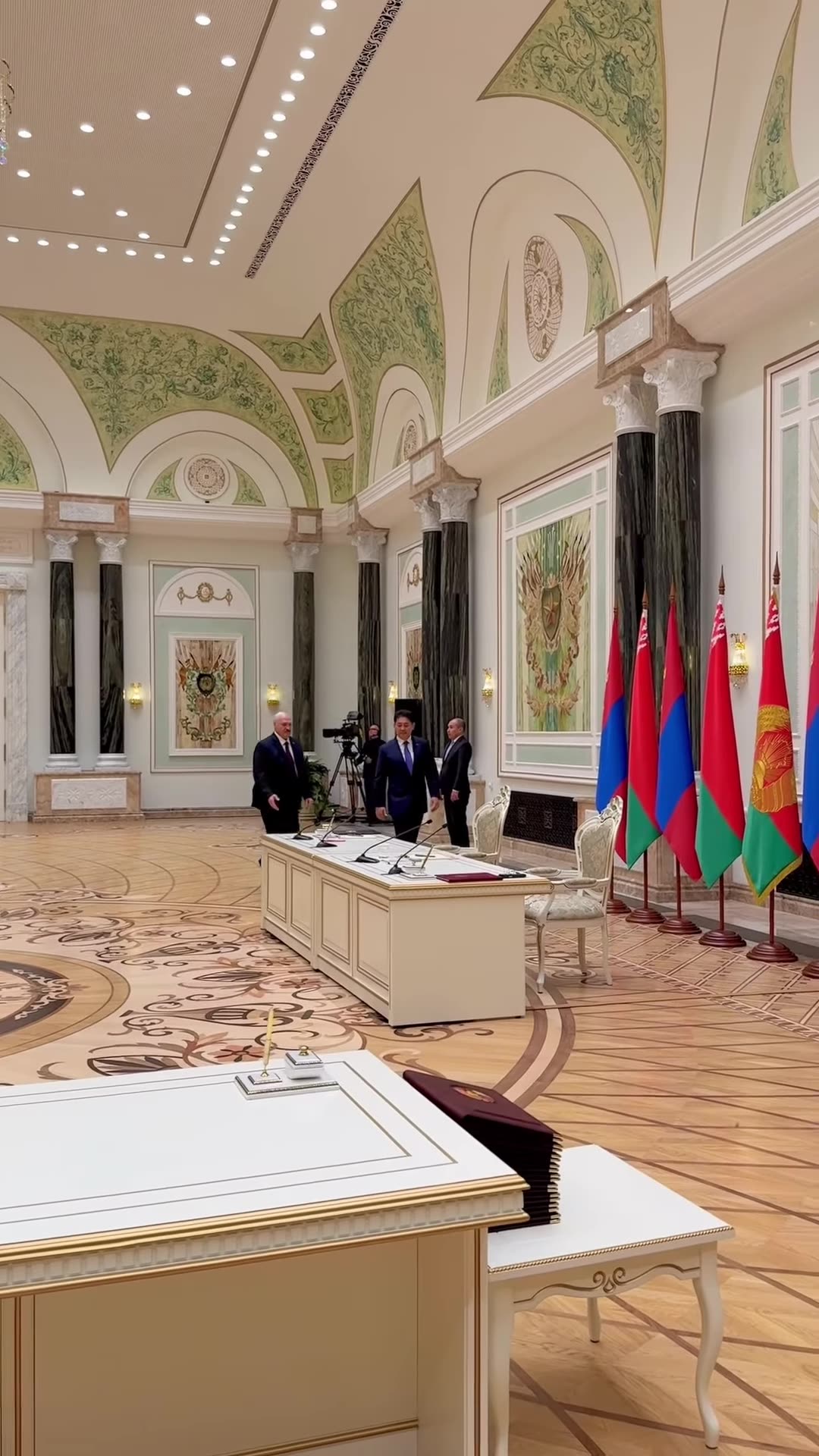 A reposted reel shows Belarus's president and Mongolia's president entering the ornate State Awards Hall to sign agreements, with delegations, an honor guard, flags and press watching.